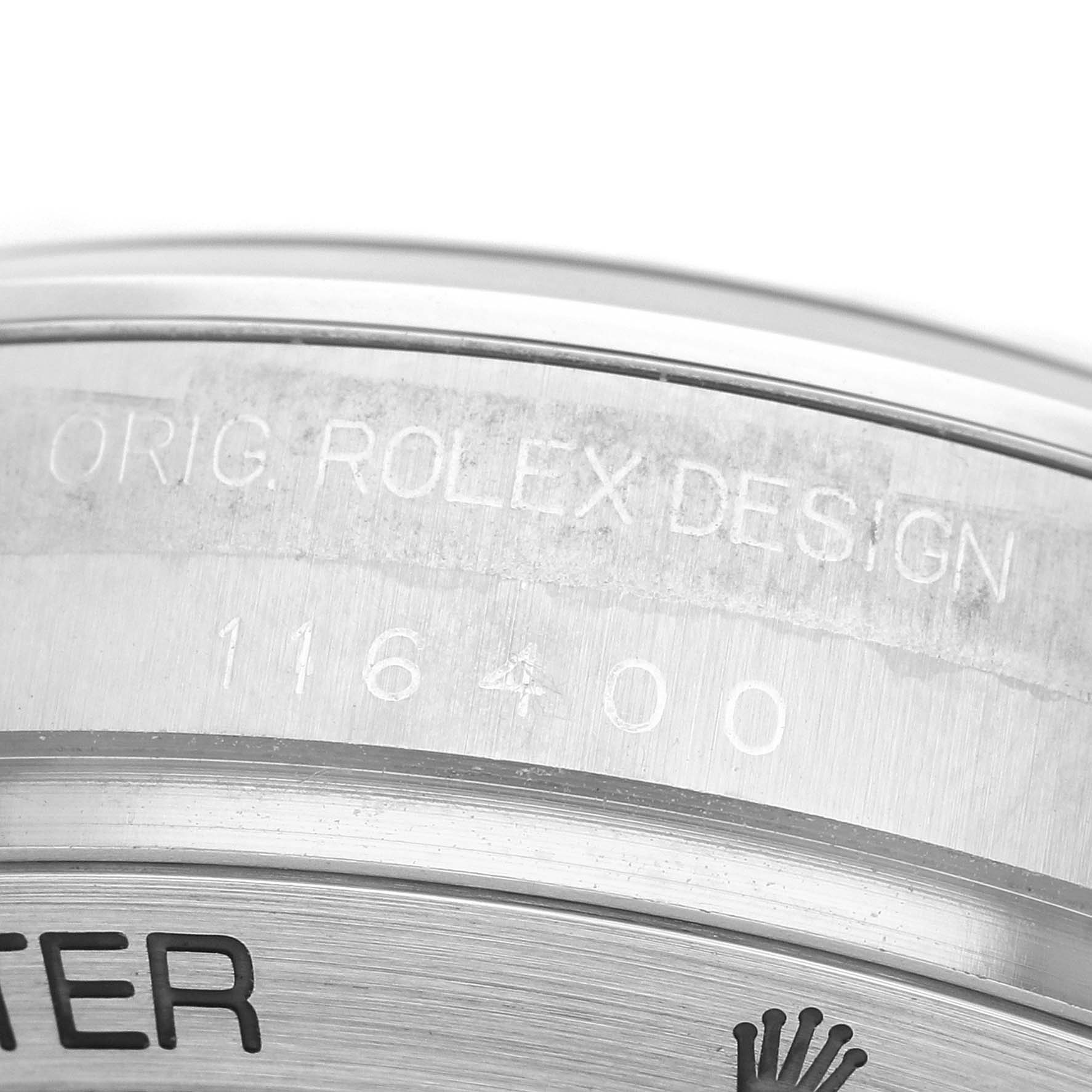 The image shows a close-up of the side of a Rolex Milgauss M116400GV-0001 Men's Stainless Steel Black Dial watch, highlighting the engraved model number "116400" and branding.