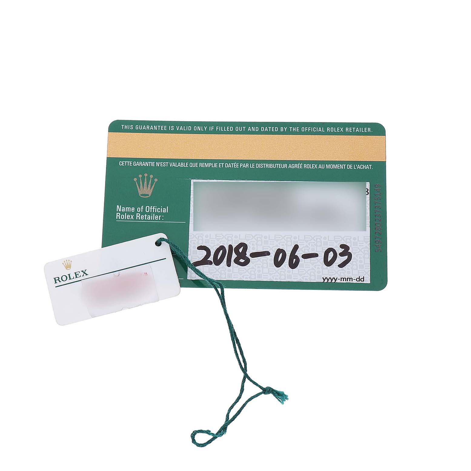 The image shows a Rolex Milgauss M116400GV-0001 Men's Stainless Steel Black Dial warranty card with a green identification tag attached.