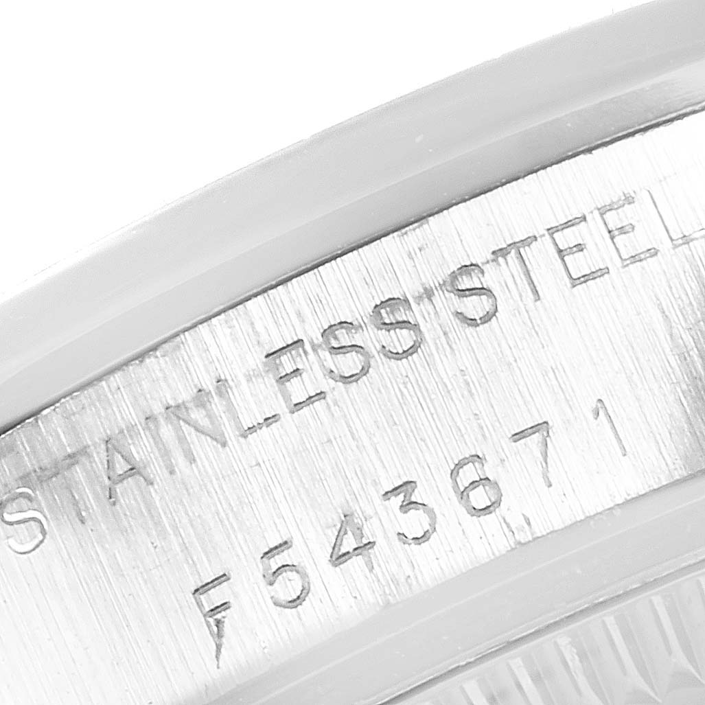 This is a close-up angle showing the serial number and "Stainless Steel" engraving on a Rolex Oyster Perpetual 76080 Women
s Stainless Steel Blue Dial 76080 Women
s Stainless Steel Blue Dial watch.