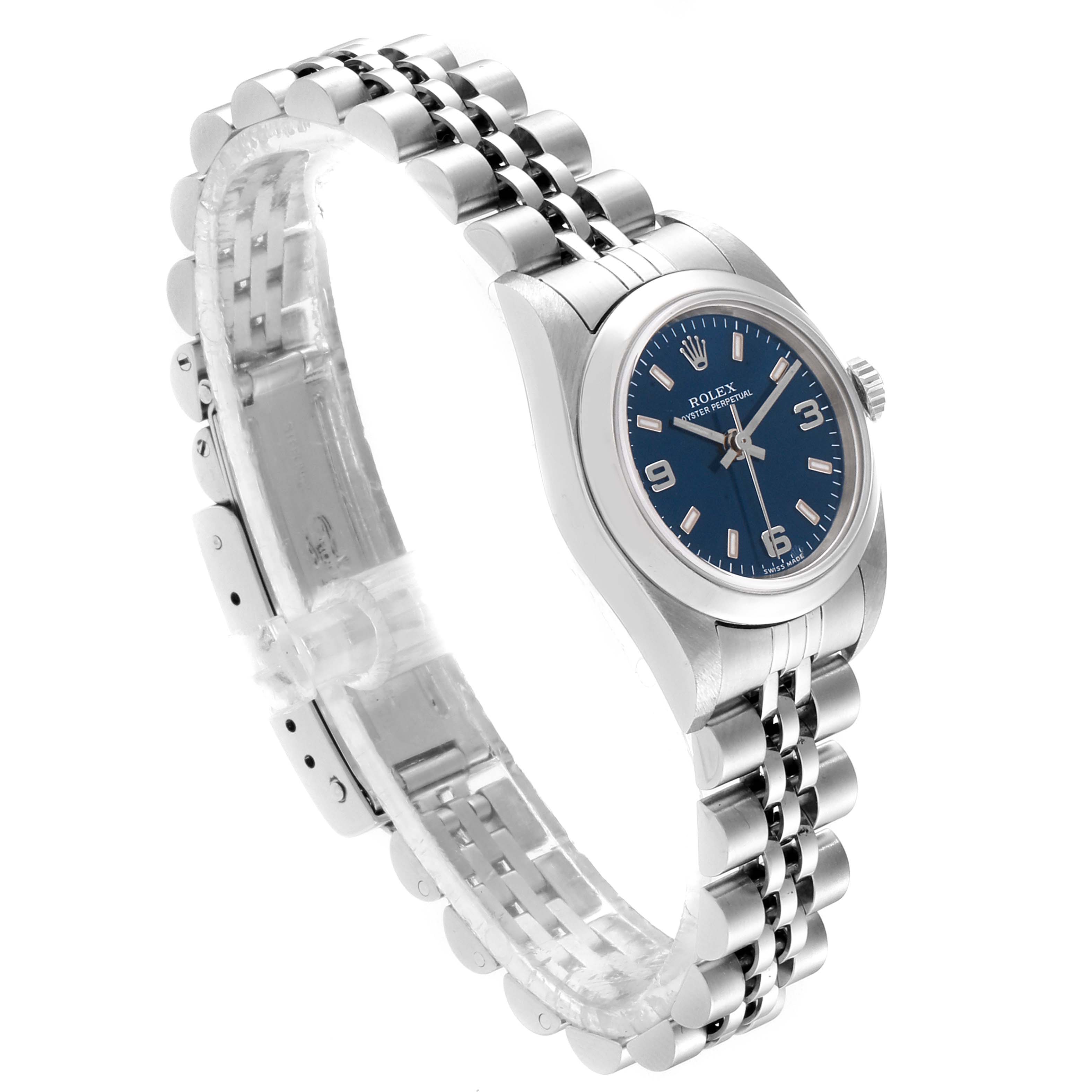 The Oyster Perpetual Rolex watch is shown at an angled view from the top-left side, displaying its stainless steel bracelet and blue dial.