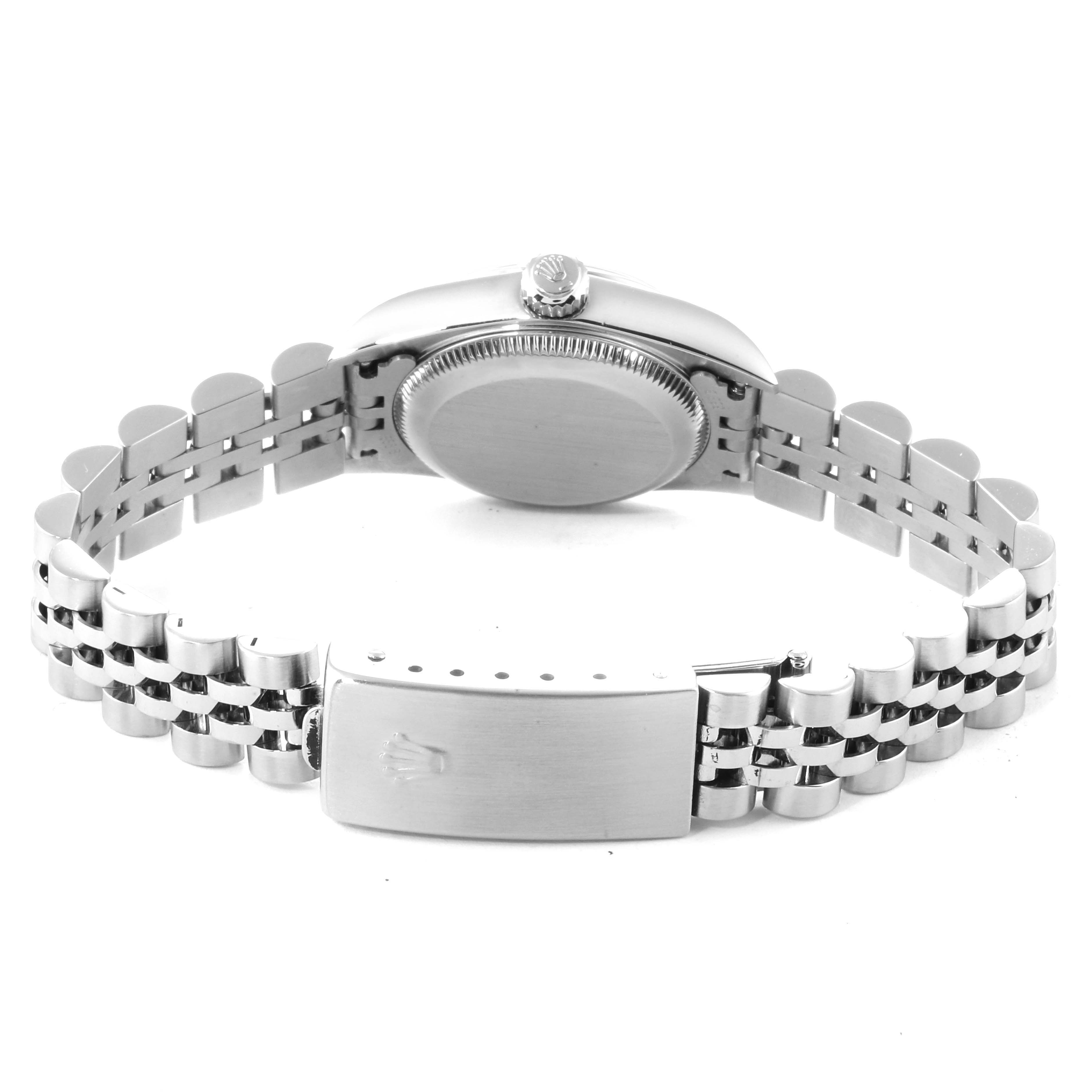 This image shows the back view of the Oyster Perpetual Rolex watch, highlighting its clasp, case back, and crown.