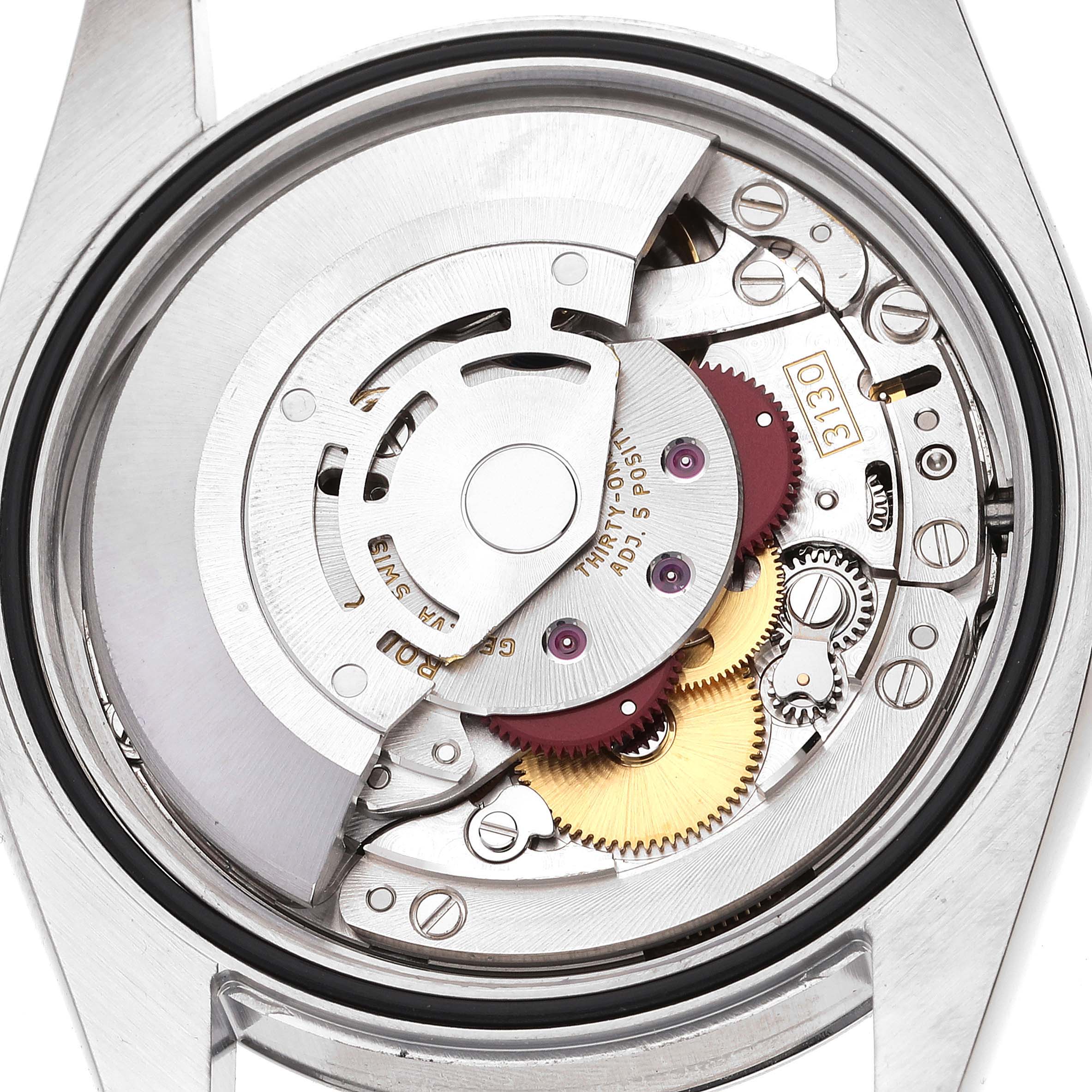 The image shows an overhead view of the movement and internal mechanisms of a Rolex Oyster Perpetual 116000 Men's Stainless Steel Silver Dial 116000 Men's Stainless Steel Silver Dial watch.
