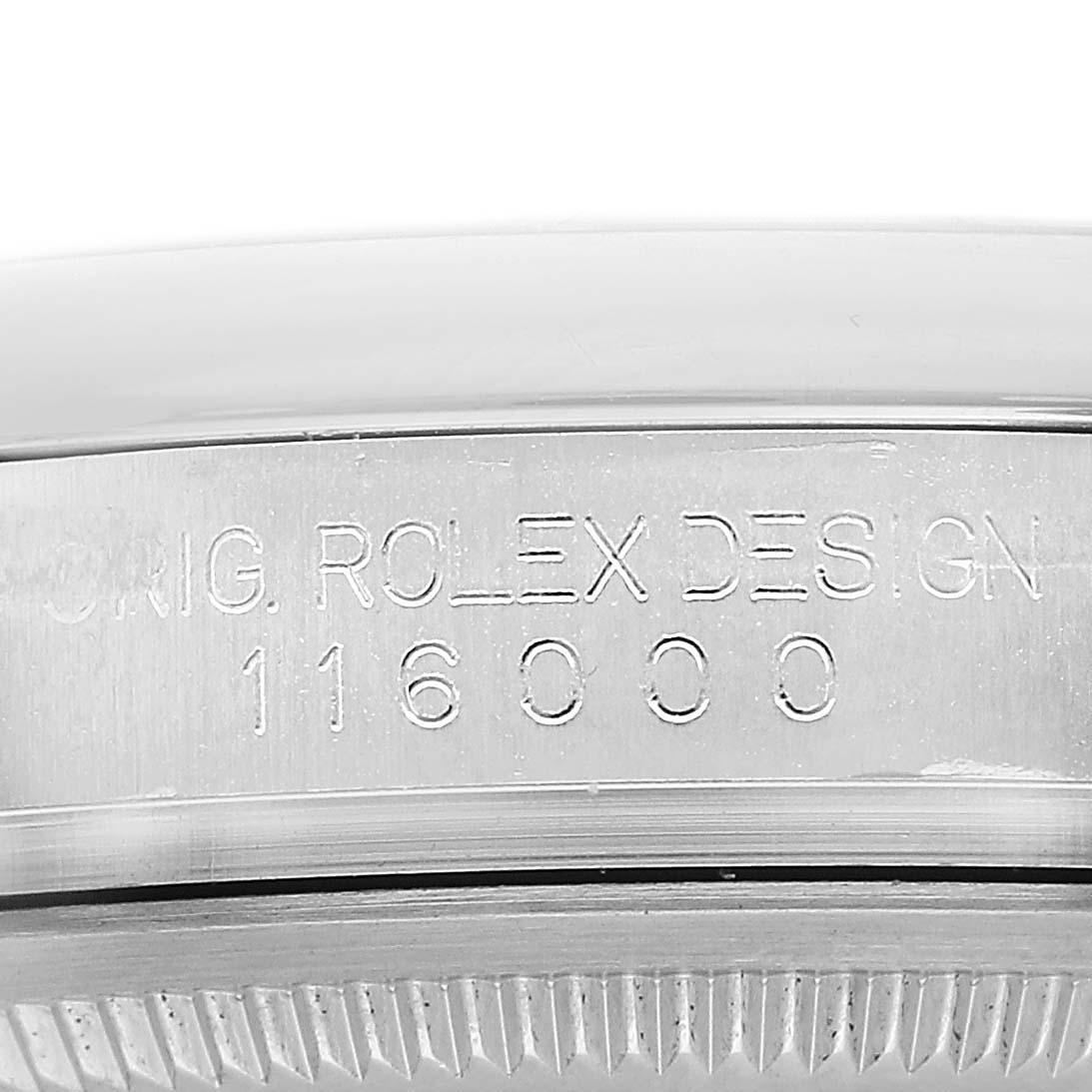 The image shows the engraved side of the case of the Rolex Oyster Perpetual 116000 Men's Stainless Steel Blue Dial, highlighting the model number.