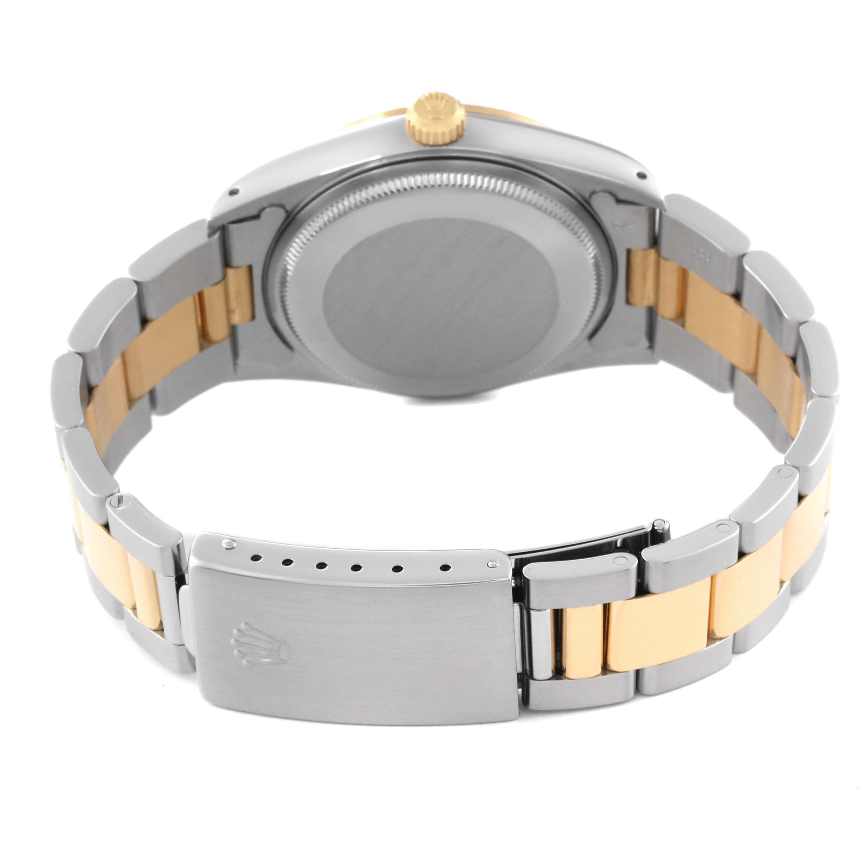 This image shows the back and bracelet of a Rolex Oyster Perpetual 14233 Men's Steel and Gold (two tone) Champagne Dial 14233 Men's Steel and Gold (two tone) Champagne Dial watch, highlighting the clasp and caseback.