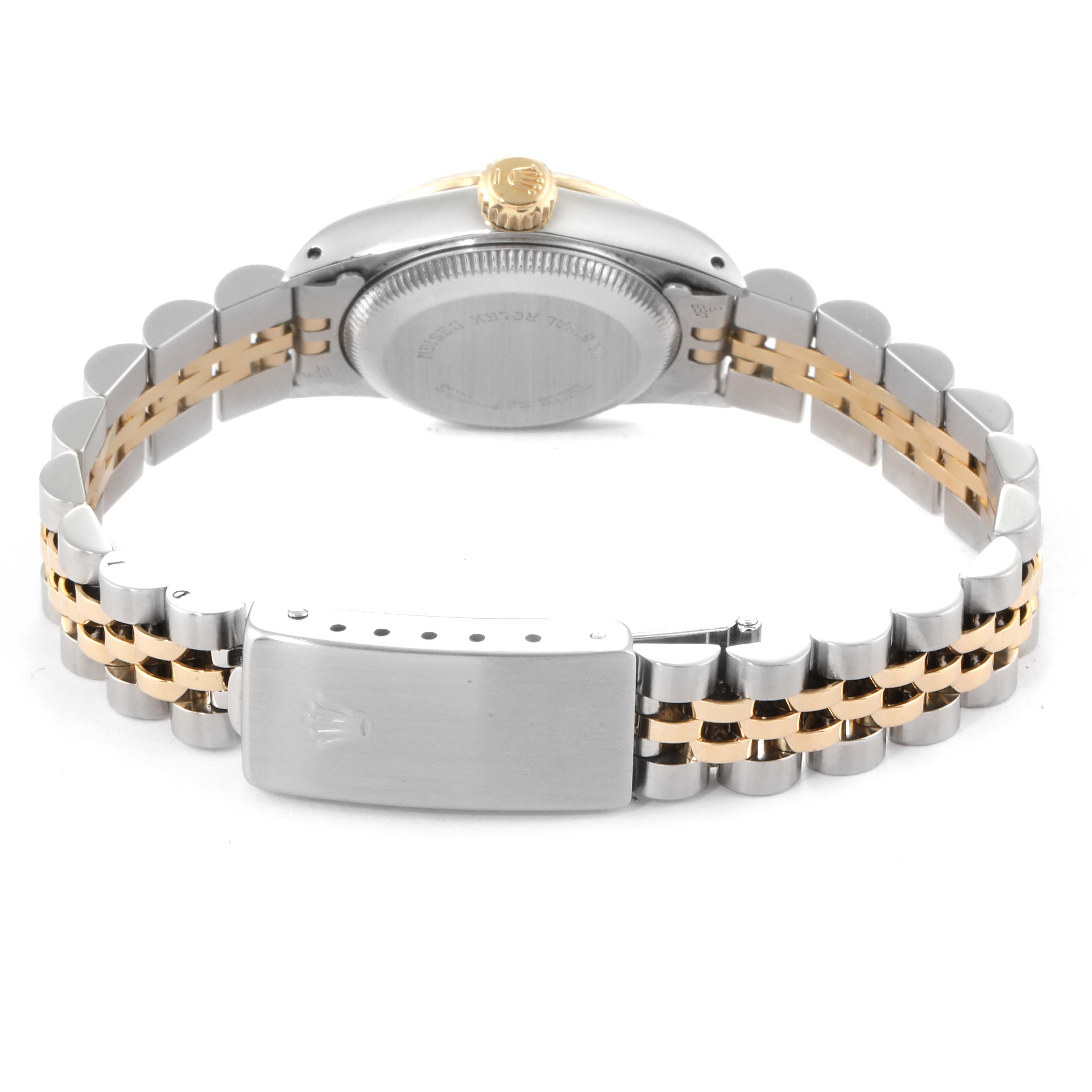 The image shows the back, clasp, and bracelet of the Rolex 67193 Women
s Steel and Gold (two tone) Champagne Dial 67193 Women
s Steel and Gold (two tone) Champagne Dial Oyster Perpetual Steel Yellow Gold Ladies Watch 67193 model at an angle.