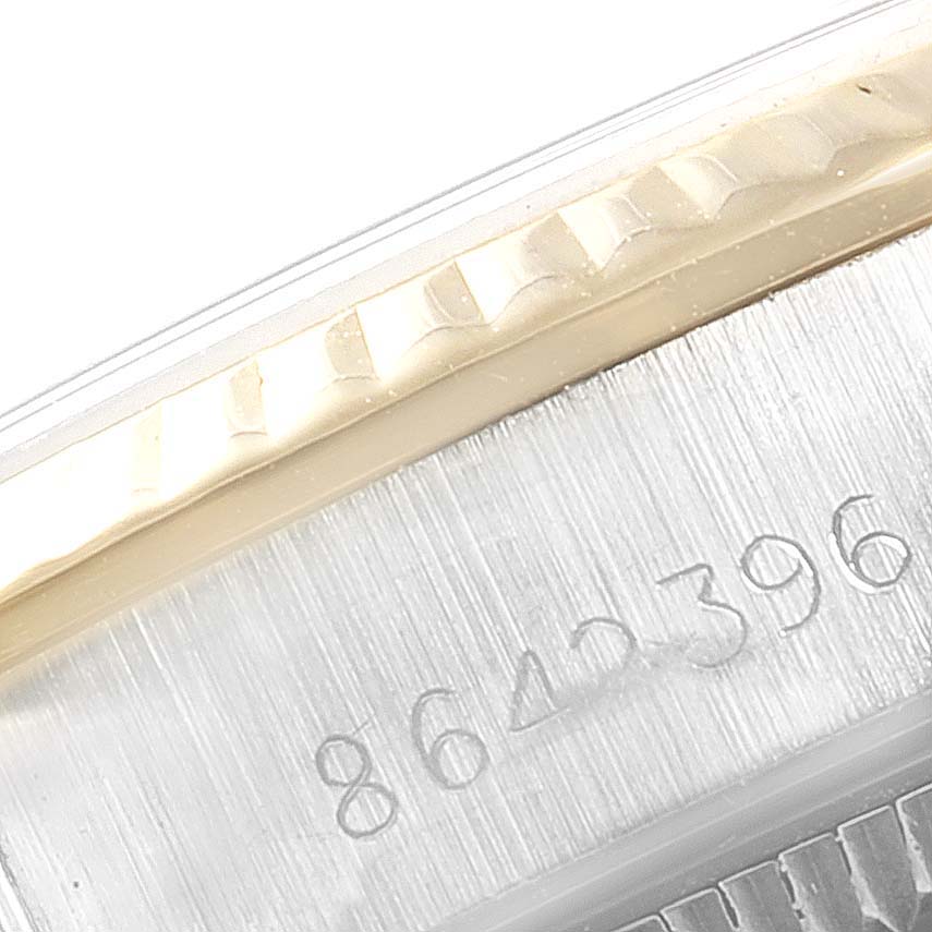 This image shows a close-up of the side of the bezel and serial number engraving of a Rolex 67193 Women
s Steel and Gold (two tone) Champagne Dial 67193 Women
s Steel and Gold (two tone) Champagne Dial Oyster Perpetual Steel Yellow Gold Ladies Watch 67193 Box model.