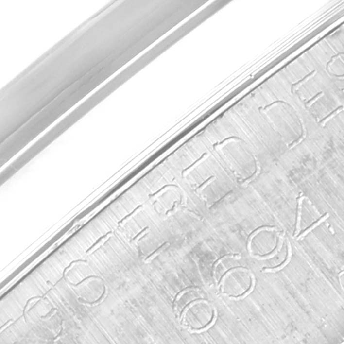 This close-up image of the Vintage Collection model by Rolex shows the engraved serial number on the watch case.