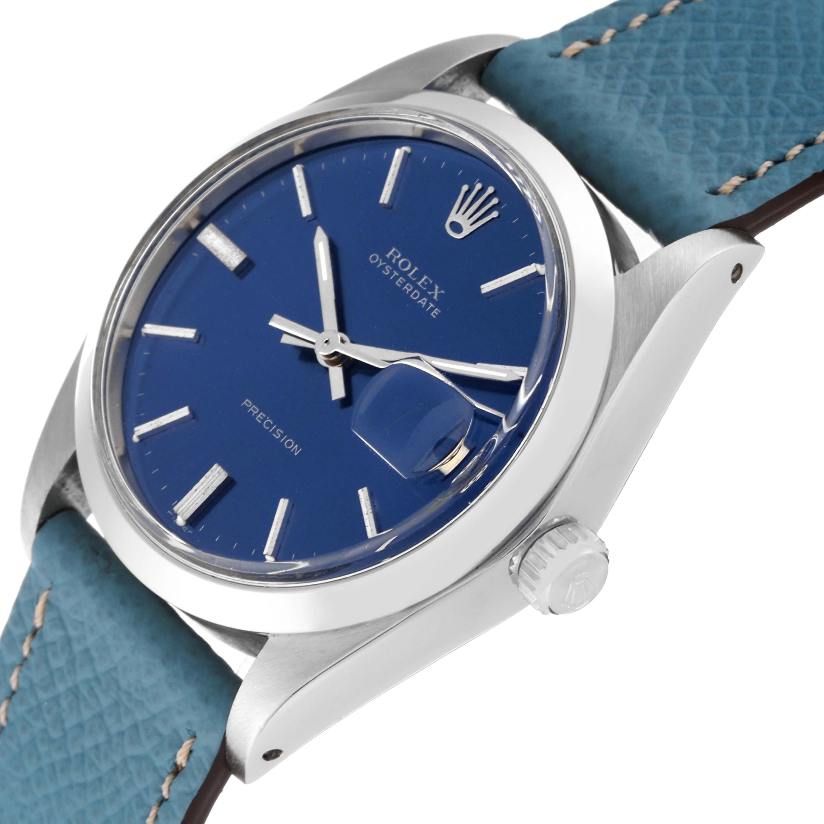 The image shows a close-up, angled view of a Rolex Vintage Collection 6694 Men's Stainless Steel Blue Dial 6694 Men's Stainless Steel Blue Dial watch, highlighting its blue dial, crown, and case.