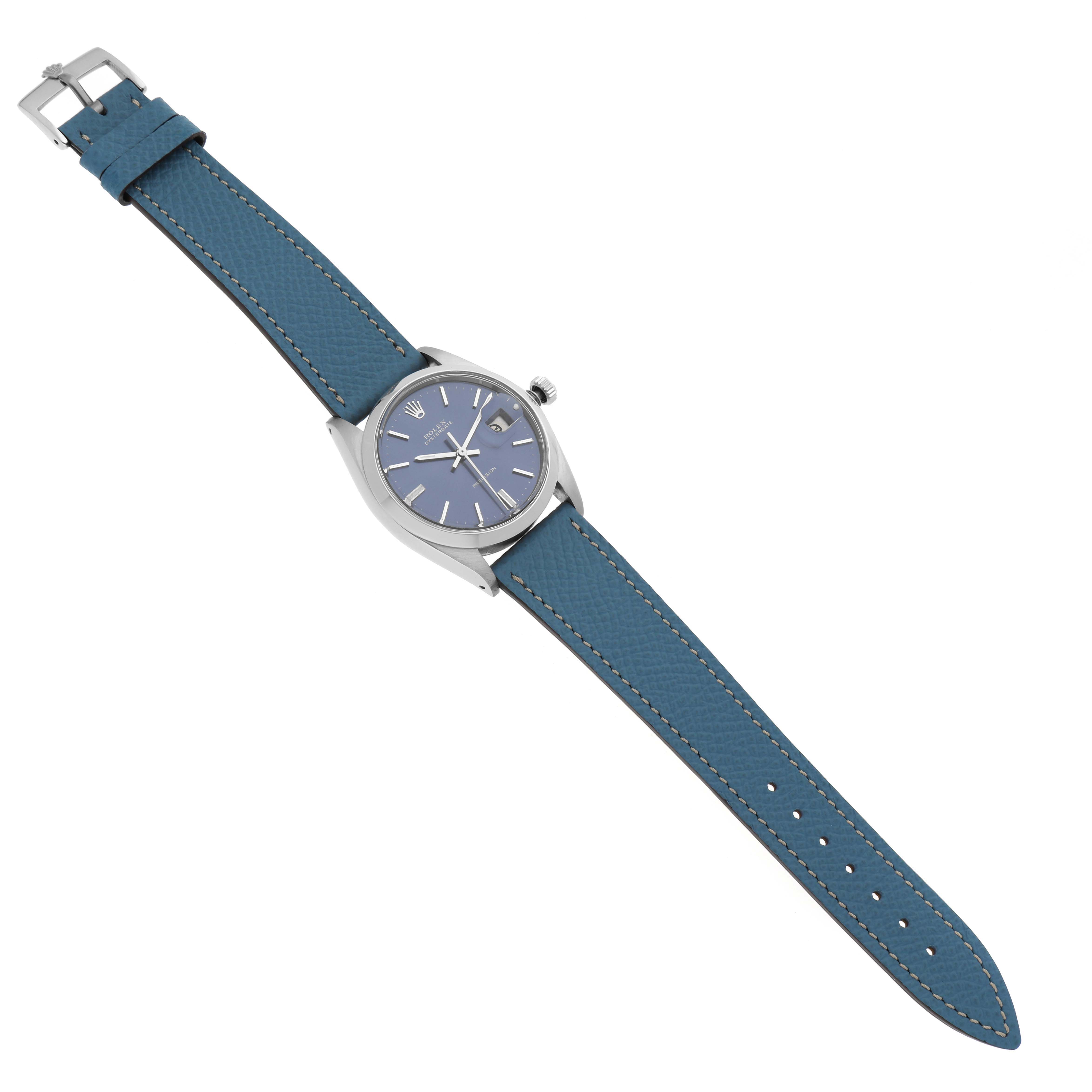 This Rolex Vintage Collection 6694 Men's Stainless Steel Blue Dial 6694 Men's Stainless Steel Blue Dial model is shown from a top view, displaying its blue leather strap and round watch face.