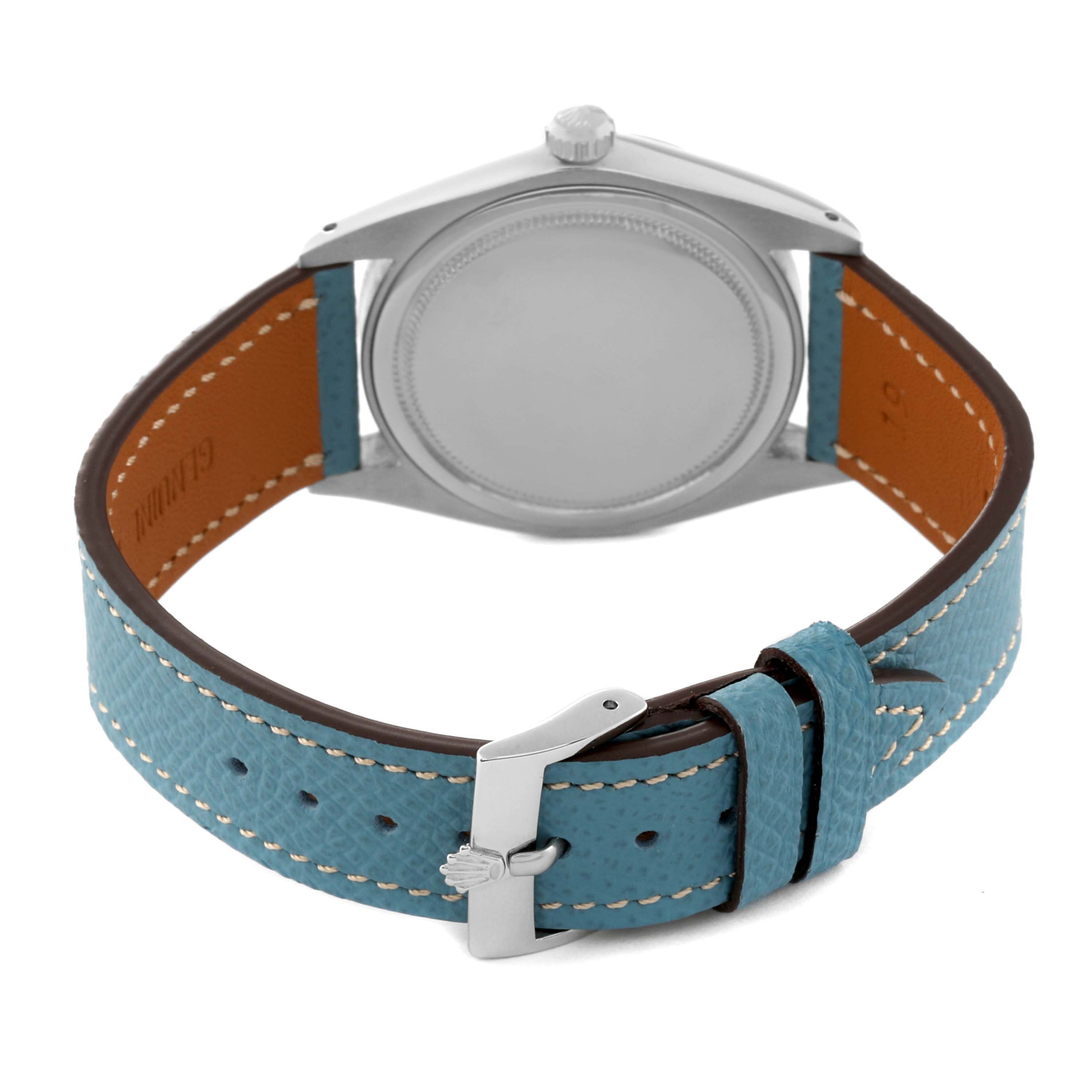 The image shows the back view of a Rolex Vintage Collection 6694 Men's Stainless Steel Blue Dial 6694 Men's Stainless Steel Blue Dial watch, highlighting its case, crown, and blue leather strap with a buckle.