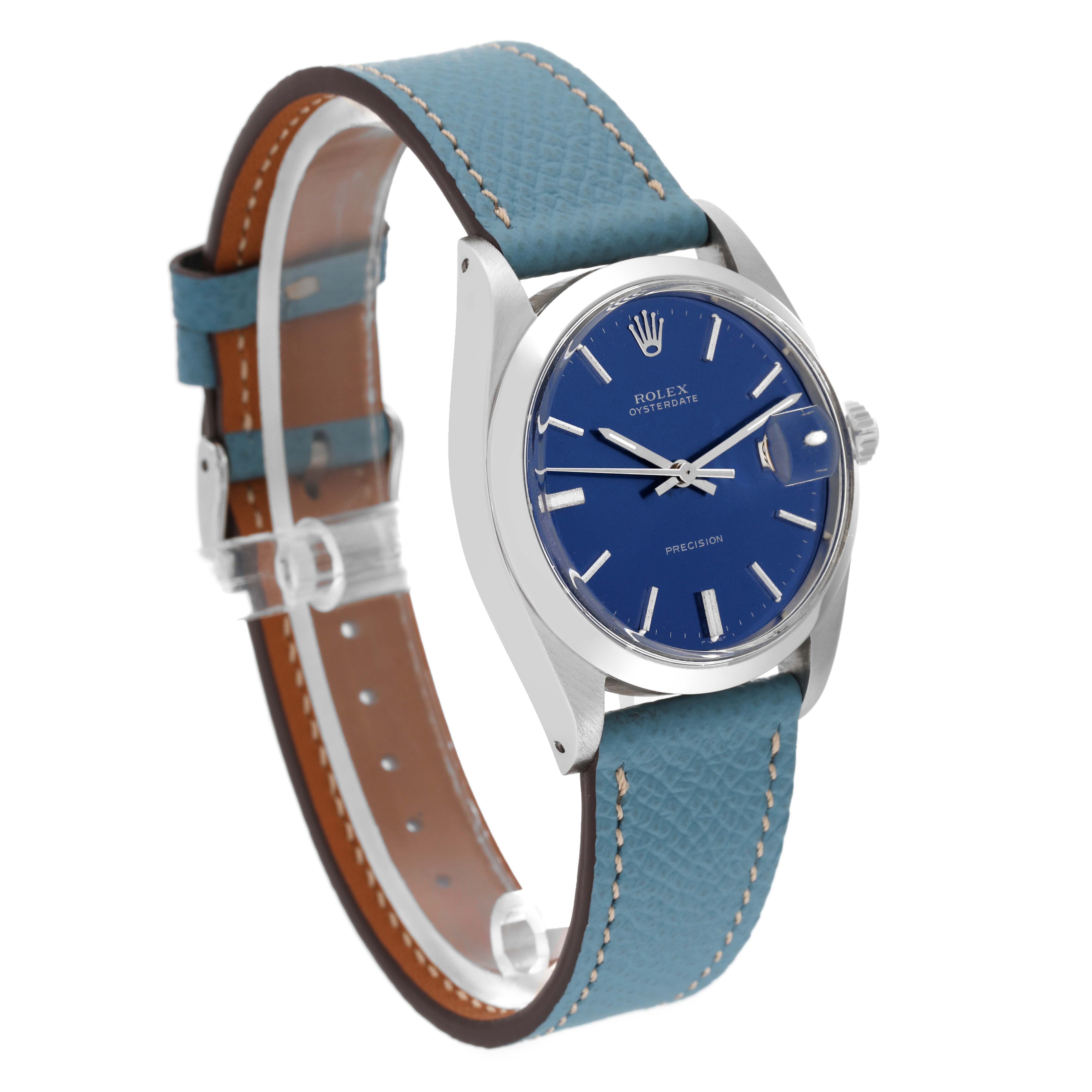 This image shows a side angle of the Rolex Vintage Collection 6694 Men's Stainless Steel Blue Dial 6694 Men's Stainless Steel Blue Dial watch, highlighting its blue dial and blue leather strap with a stainless steel case.