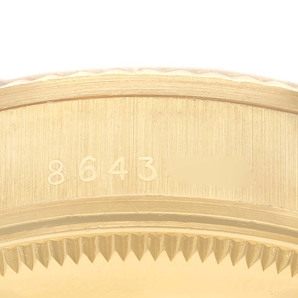 This image shows a close-up of the serial number engraved on the gold case of the Rolex President 68278 Women
s Yellow Gold Champagne Dial 68278 Women
s Yellow Gold Champagne Dial model watch.