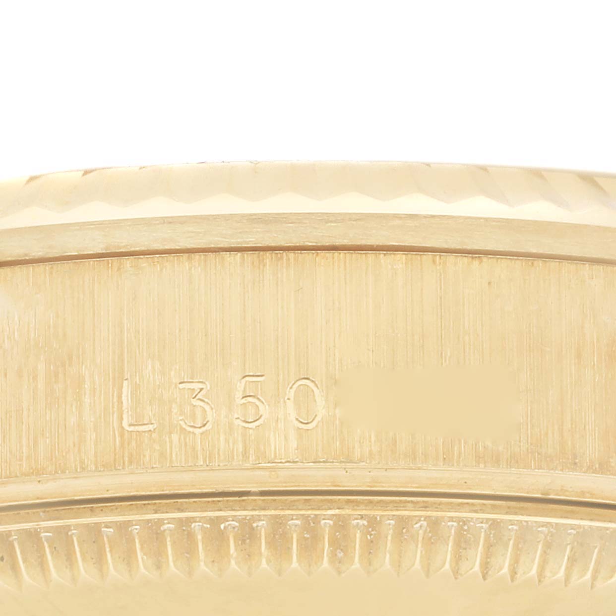 This image shows a close-up of the caseback serial number of a Rolex President 68278 Women's Yellow Gold Champagne Dial 68278 Women's Yellow Gold Champagne Dial model watch.