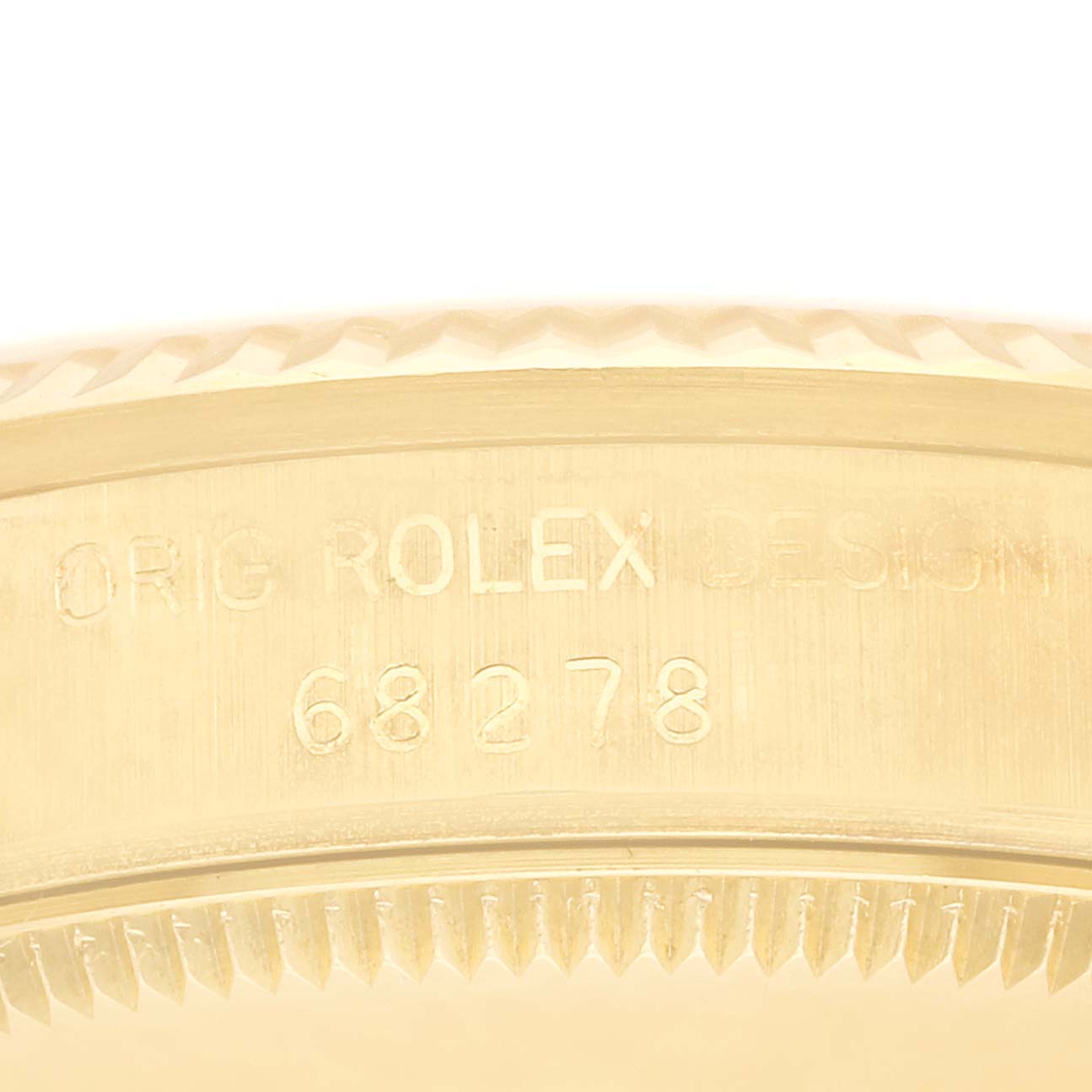 This image shows a close-up of the case side and bezel of a Rolex President 68278 Women
s Yellow Gold Champagne Dial 68278 Women
s Yellow Gold Champagne Dial model, displaying its engraved design number 68278.