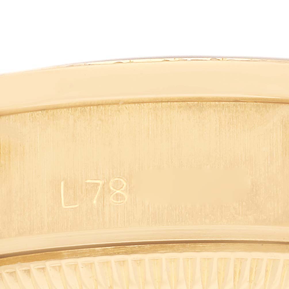 This image shows a close-up angle of the side of a Rolex President 69138G Women's Yellow Gold White Dial 69138G Women's Yellow Gold White Dial watch, with a visible serial number.