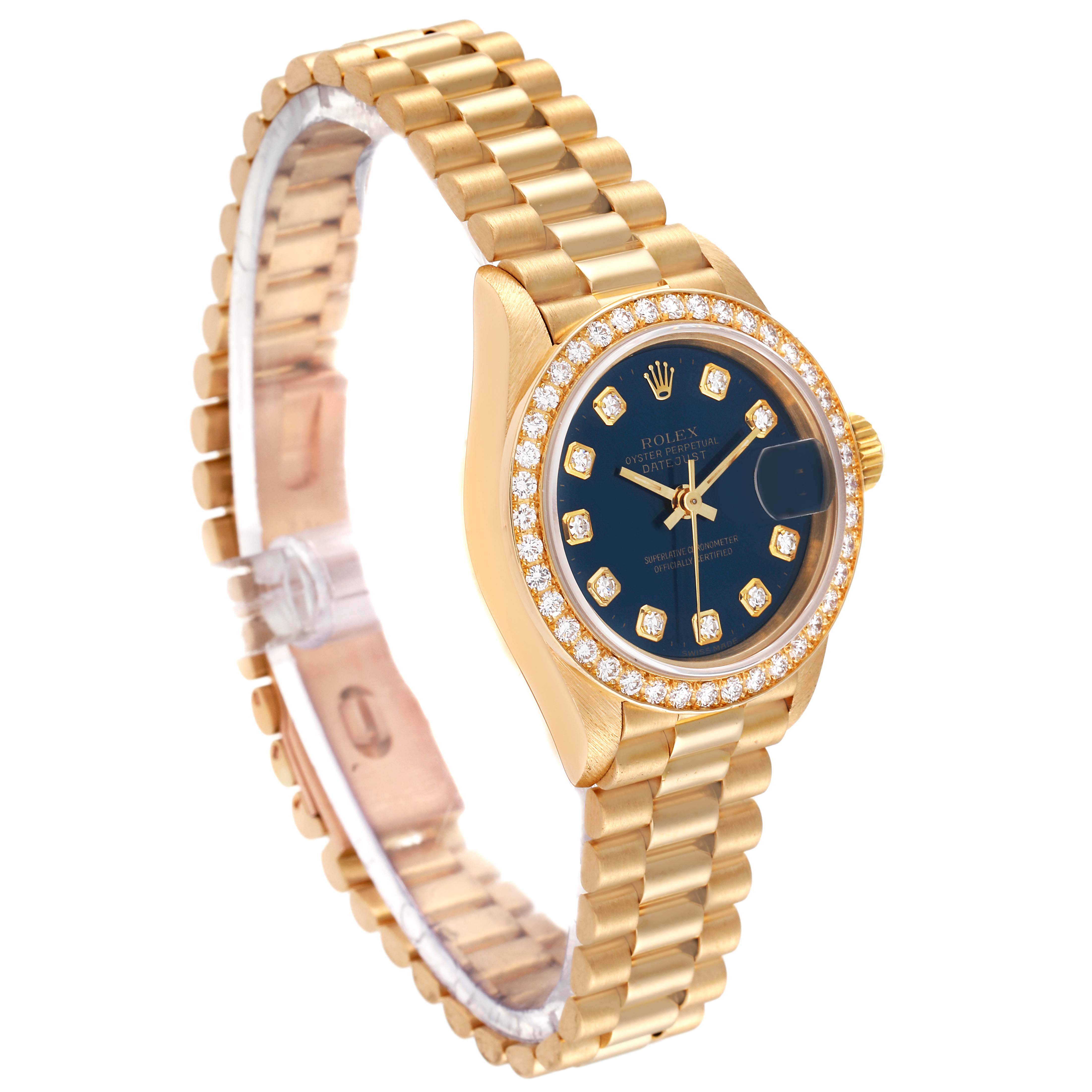 The Rolex President 69138 Women's Yellow Gold Blue Dial 69138 Women's Yellow Gold Blue Dial model watch is shown at a three-quarter angle, displaying its gold bracelet and diamond-encrusted bezel.