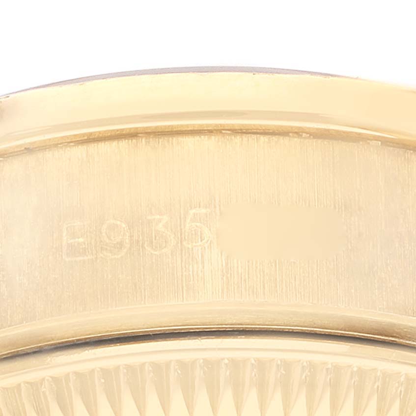 This close-up shows the side casing with a serial number of a Rolex President 69138 Women's Yellow Gold Blue Dial 69138 Women's Yellow Gold Blue Dial model watch.