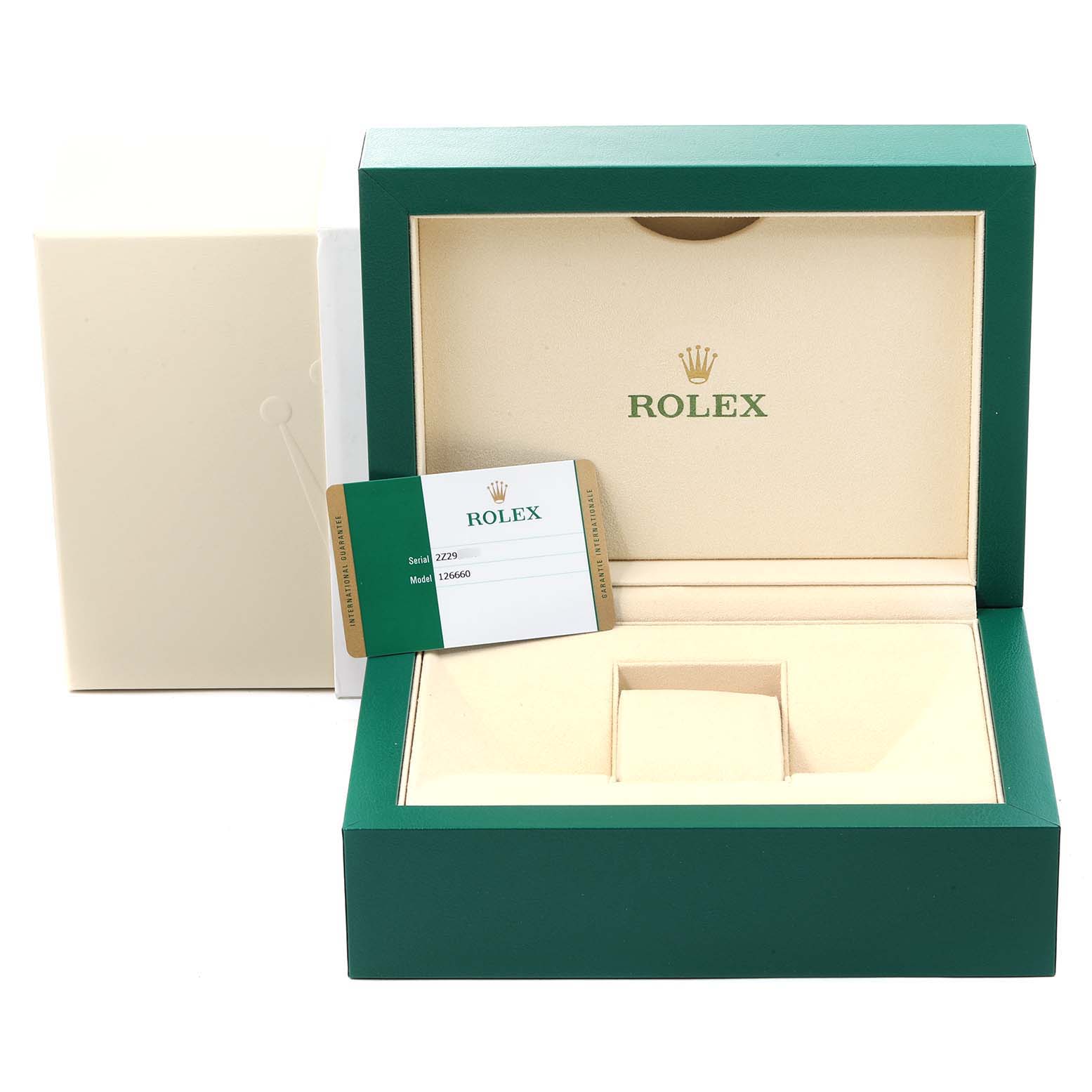 The image shows an open Rolex watch box for the Sea-Dweller model with a warranty card placed inside.
