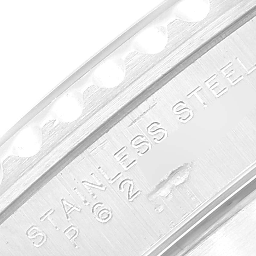 The image shows a close-up angle of the stainless steel bezel and engraving on the Rolex Submariner 14060 Men
s Stainless Steel Black Dial 14060 Men
s Stainless Steel Black Dial model.