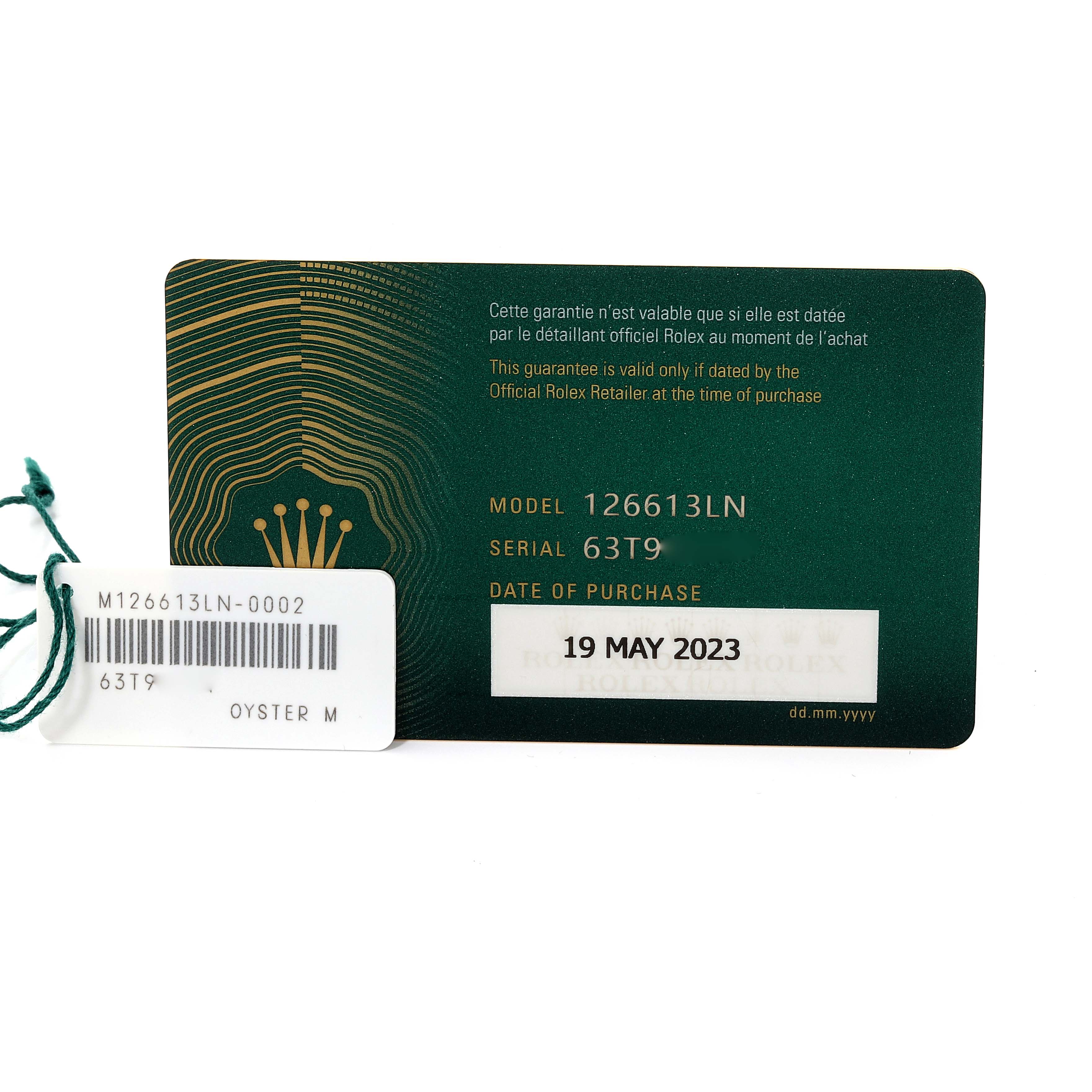 The image shows a warranty card for the Rolex Submariner M126613LN-0002 Men's Steel and Gold (two tone) Black Dial M126613LN-0002 Men's Steel and Gold (two tone) Black Dial model 126613LN, with a serial number and date of purchase.