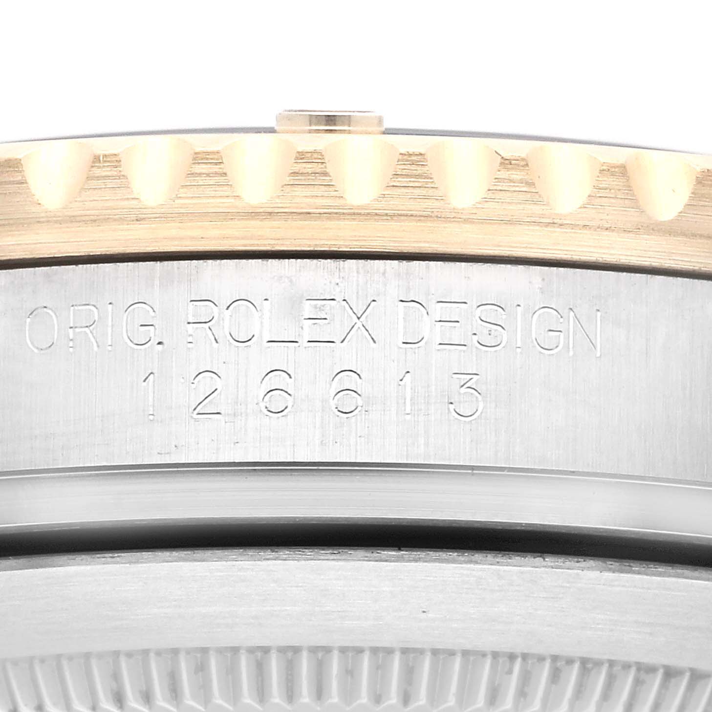 The image shows a close-up of the side of a Rolex Submariner M126613LN-0002 Men's Steel and Gold (two tone) Black Dial M126613LN-0002 Men's Steel and Gold (two tone) Black Dial model, highlighting the model number 126613 and original Rolex design engraving.