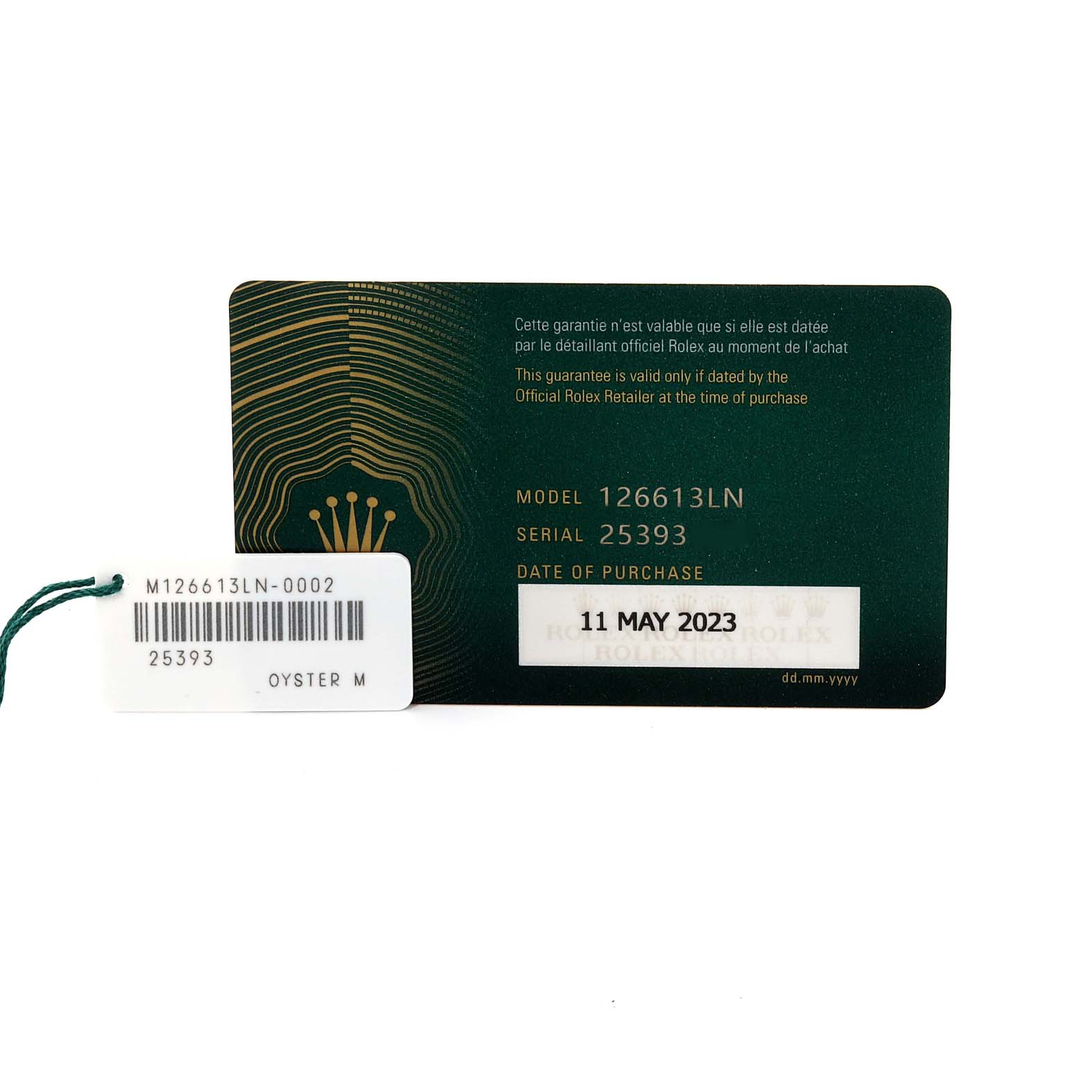 The image shows the warranty card and model tag for a Rolex Submariner M126613LN-0002 Men's Steel and Gold (two tone) Black Dial M126613LN-0002 Men's Steel and Gold (two tone) Black Dial model 126613LN, including the serial number and purchase date.