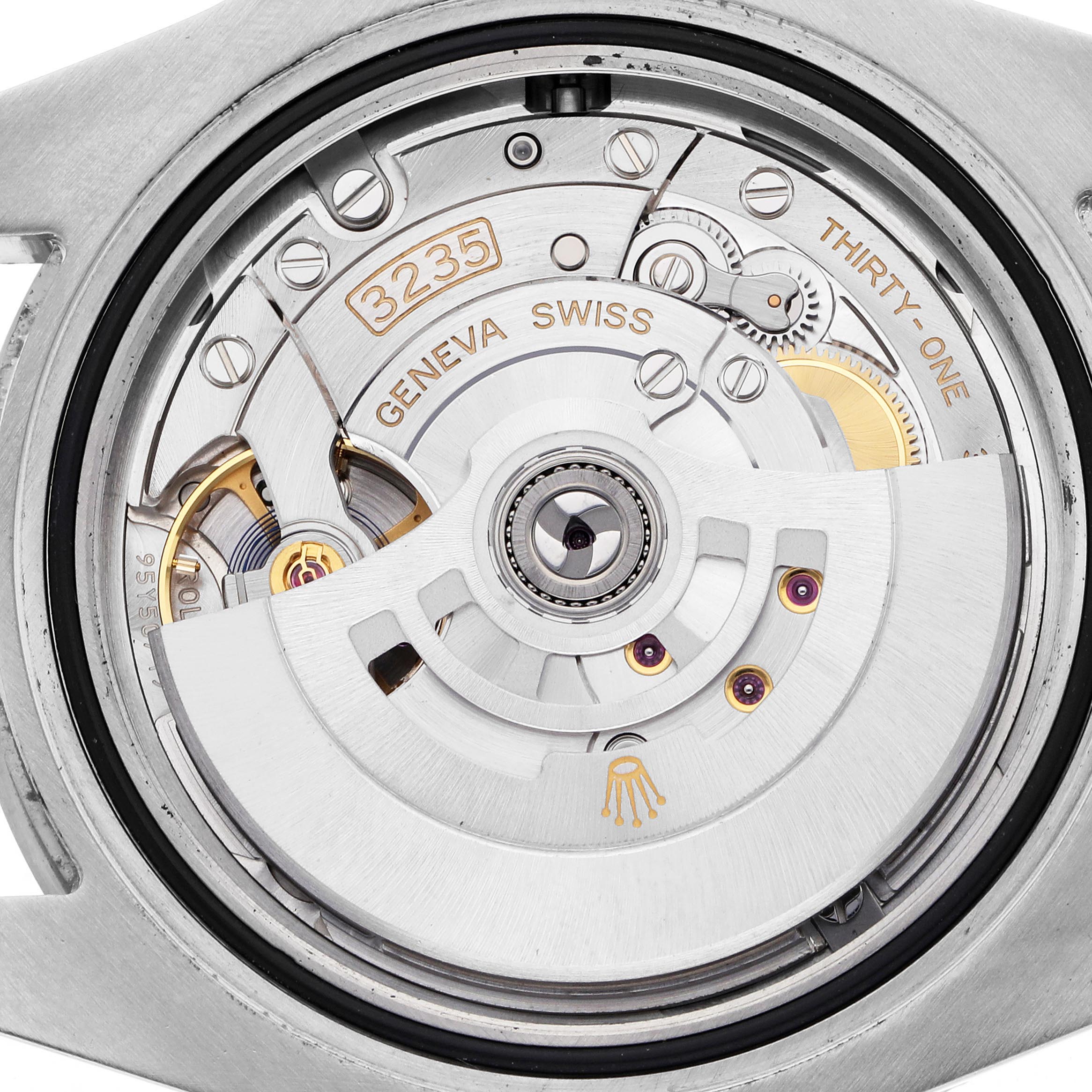 The image shows the Rolex Submariner 126610LN Men's Stainless Steel Black Dial 126610LN Men's Stainless Steel Black Dial's movement at a macro angle, highlighting its rotor and intricate internal components.