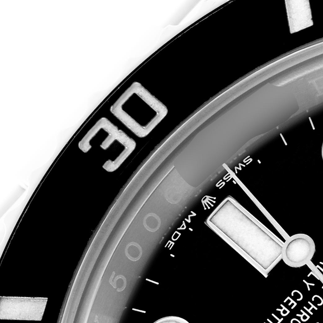 The image shows a partial close-up of the Rolex Submariner 126610LN Men's Stainless Steel Black Dial 126610LN Men's Stainless Steel Black Dial's bezel and hour hand at an angle, highlighting the "30" marker.