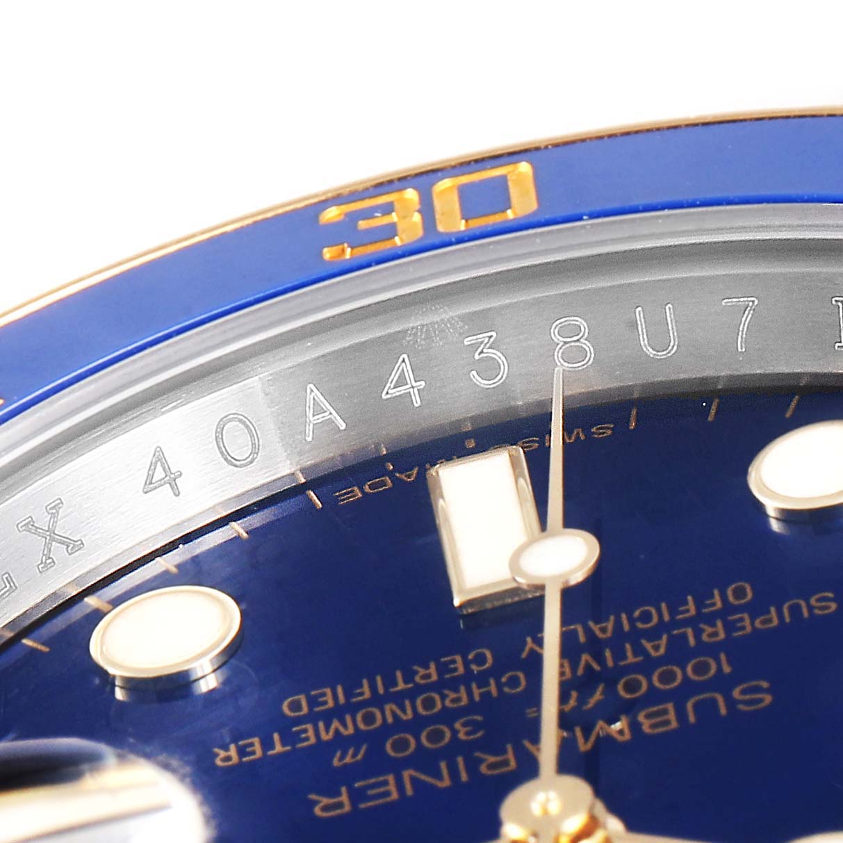 This close-up image of the Rolex Submariner 116613 Men's Stainless Steel Blue Dial 116613 Men's Stainless Steel Blue Dial watch shows the blue dial, gold hands, and part of the bezel with the "30" marker.
