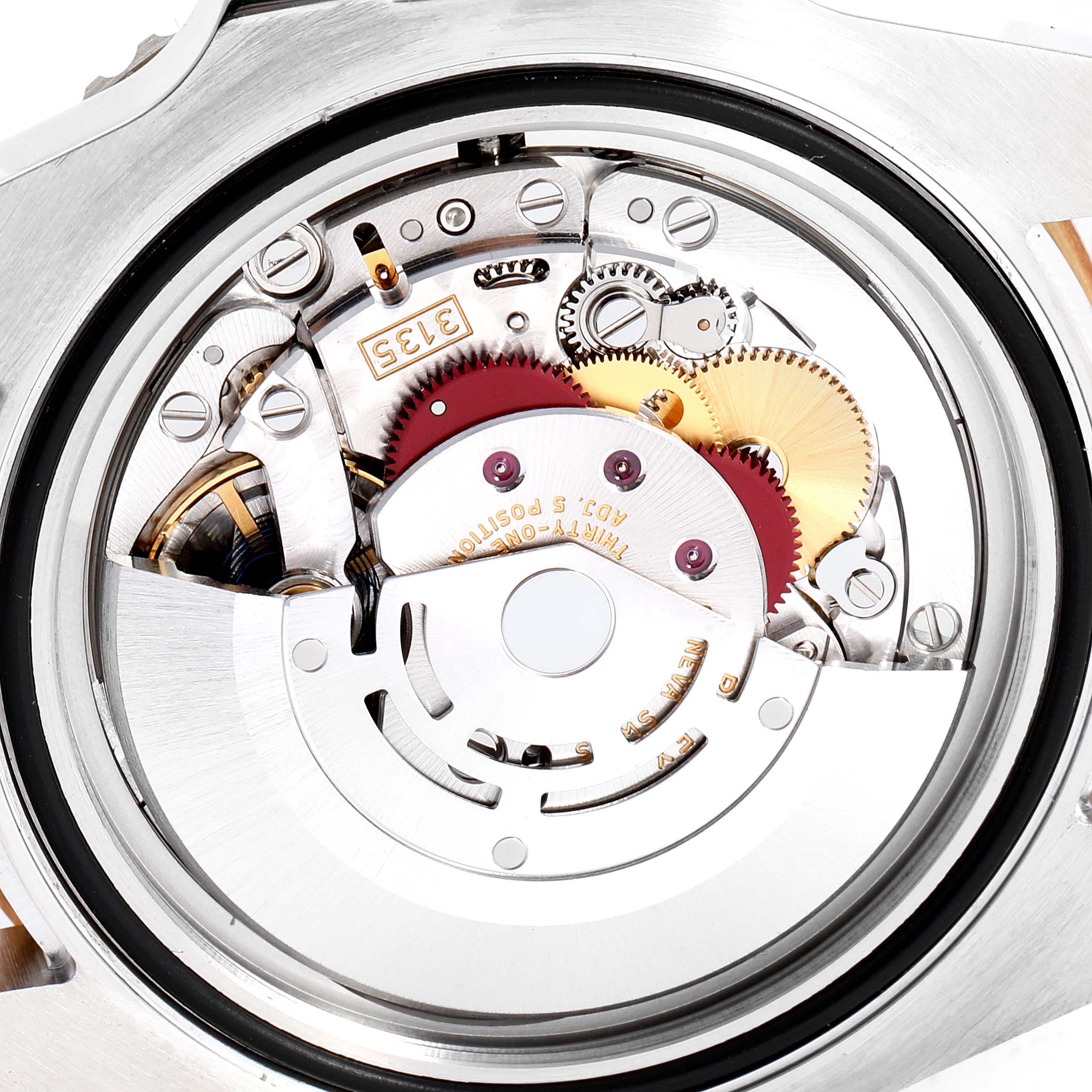This is a close-up view of the movement mechanism of a Rolex Submariner 116613 Men
s Stainless Steel Blue Dial 116613 Men
s Stainless Steel Blue Dial watch.