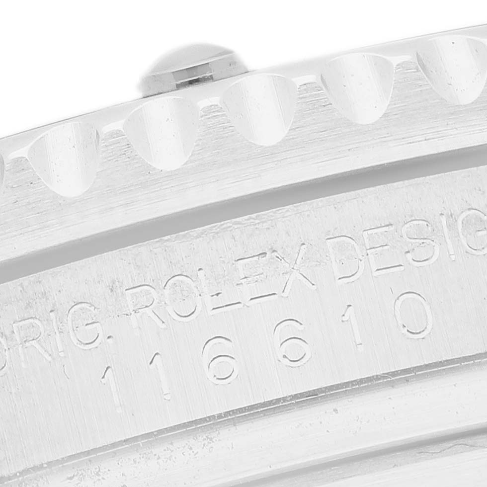 The image shows a close-up of the Rolex Submariner 116610LN Men's Stainless Steel Black Dial's engraved side and ridged edge of the bezel.