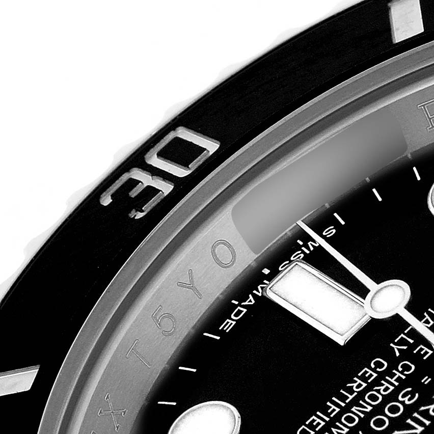 The image shows a close-up of the bezel, dial, and minute hand of a Rolex Submariner 116610LN Men's Stainless Steel Black Dial watch.