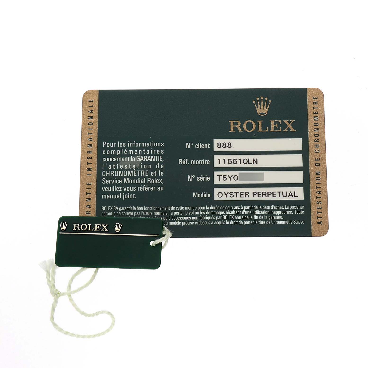 The image shows a Rolex Submariner 116610LN Men's Stainless Steel Black Dial warranty card and a Rolex tag, both viewed from above.