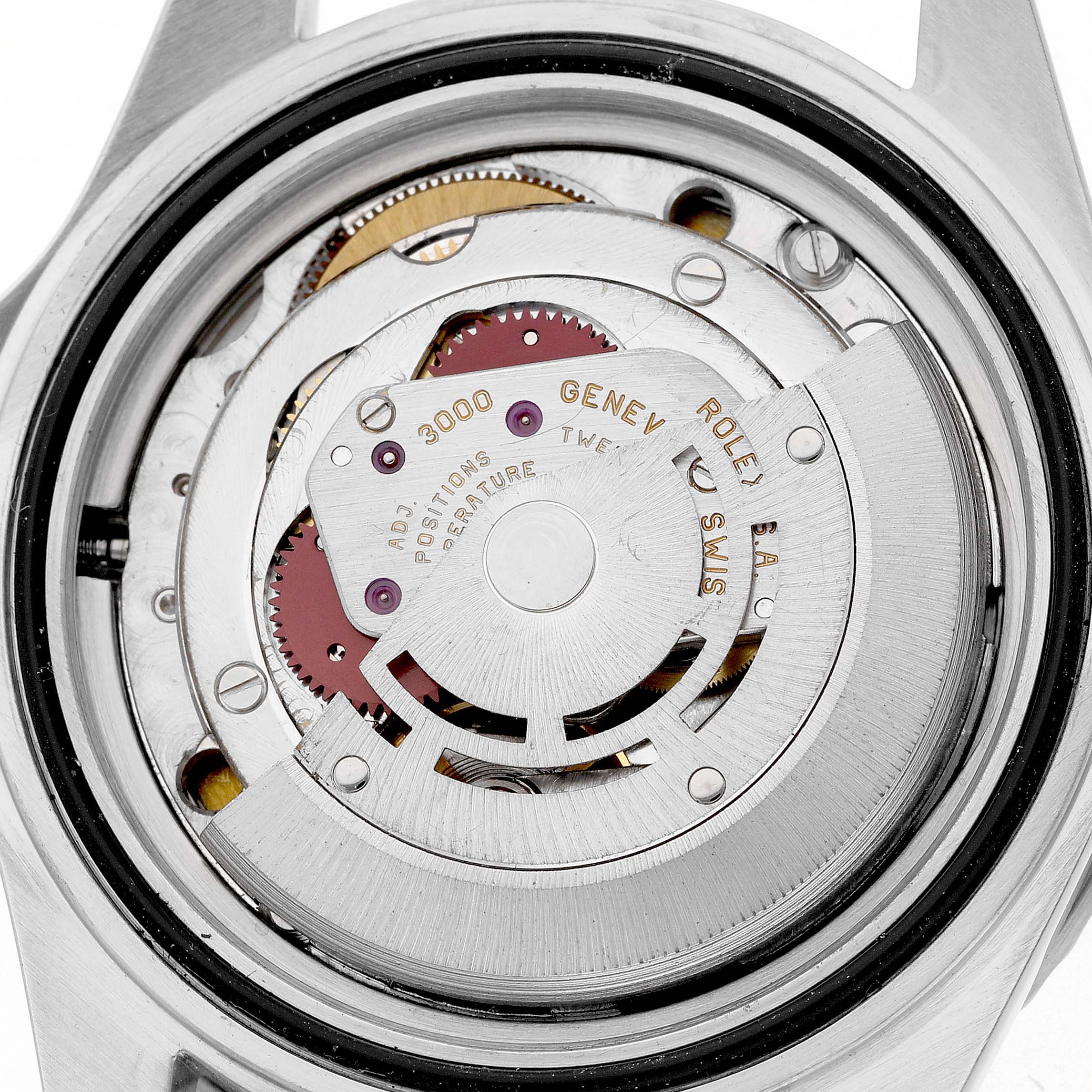 The image shows the movement mechanism of a Rolex Submariner 14060 Men's Stainless Steel Black Dial, viewed from the back with the case open.