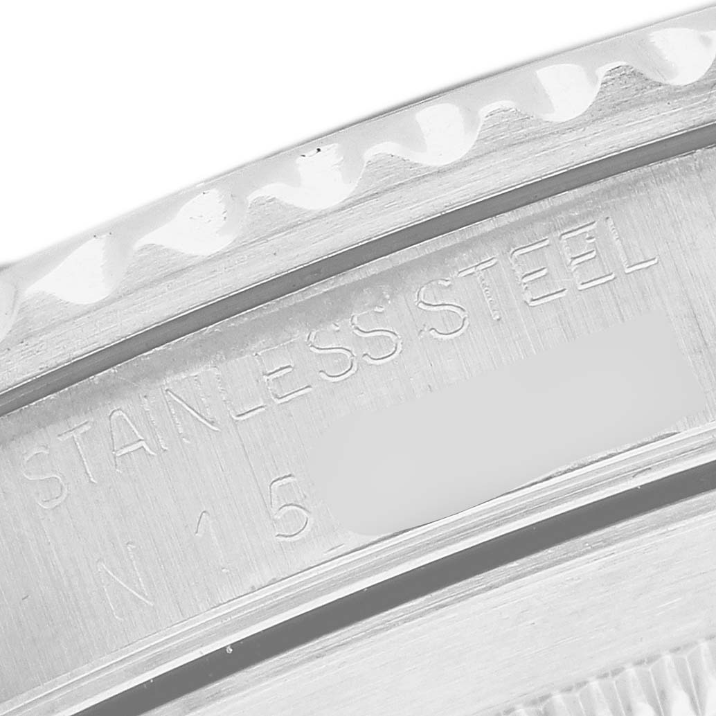 The image shows a close-up of the case back edge of a Rolex Submariner 14060 Men's Stainless Steel Black Dial, highlighting the stainless steel engraving.
