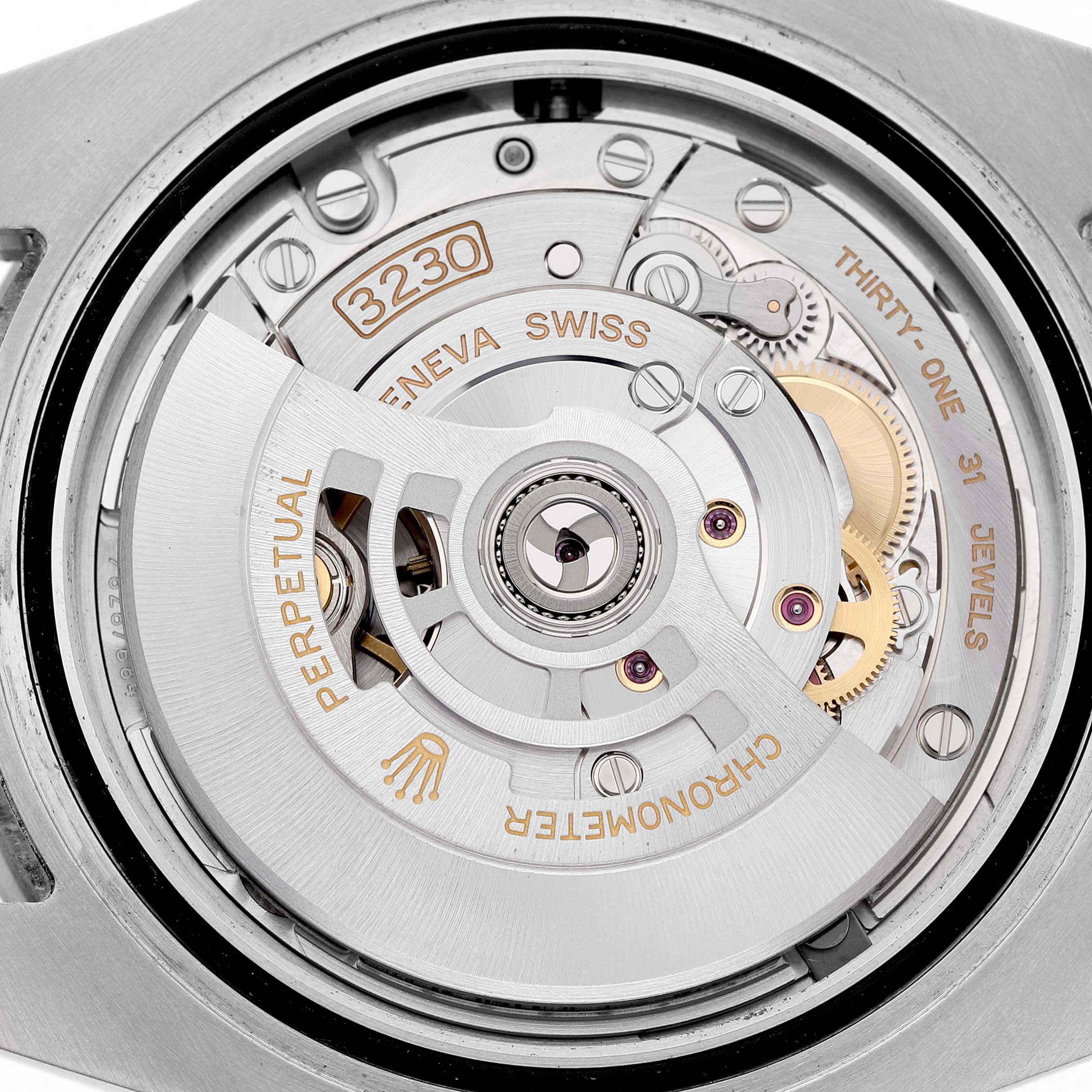 The image shows the movement of a Rolex Submariner M124060-0001 Men's Stainless Steel Black Dial, highlighting the rotor and intricate internal components.