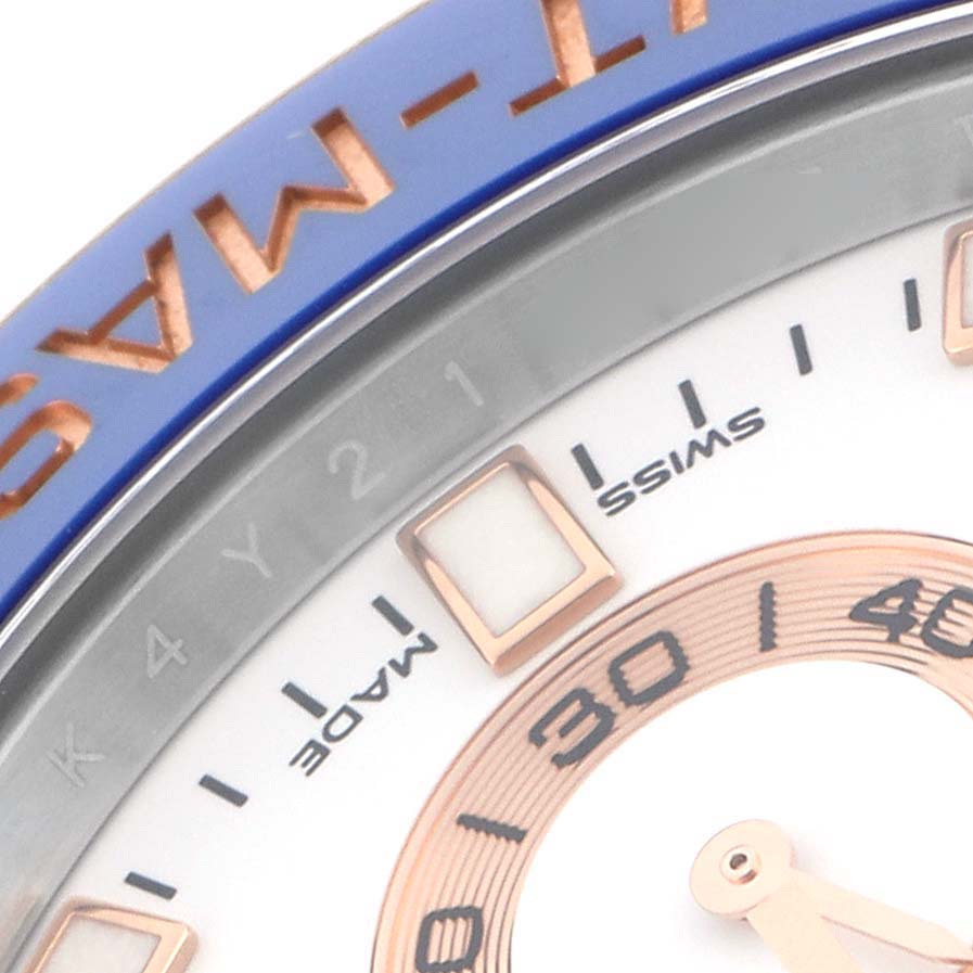 The image shows a close-up of the Rolex Yacht-Master 116681 Men
s Steel and Gold (two tone) White Dial 116681 Men
s Steel and Gold (two tone) White Dial watch dial, highlighting the bezel, indices, and part of the hands.