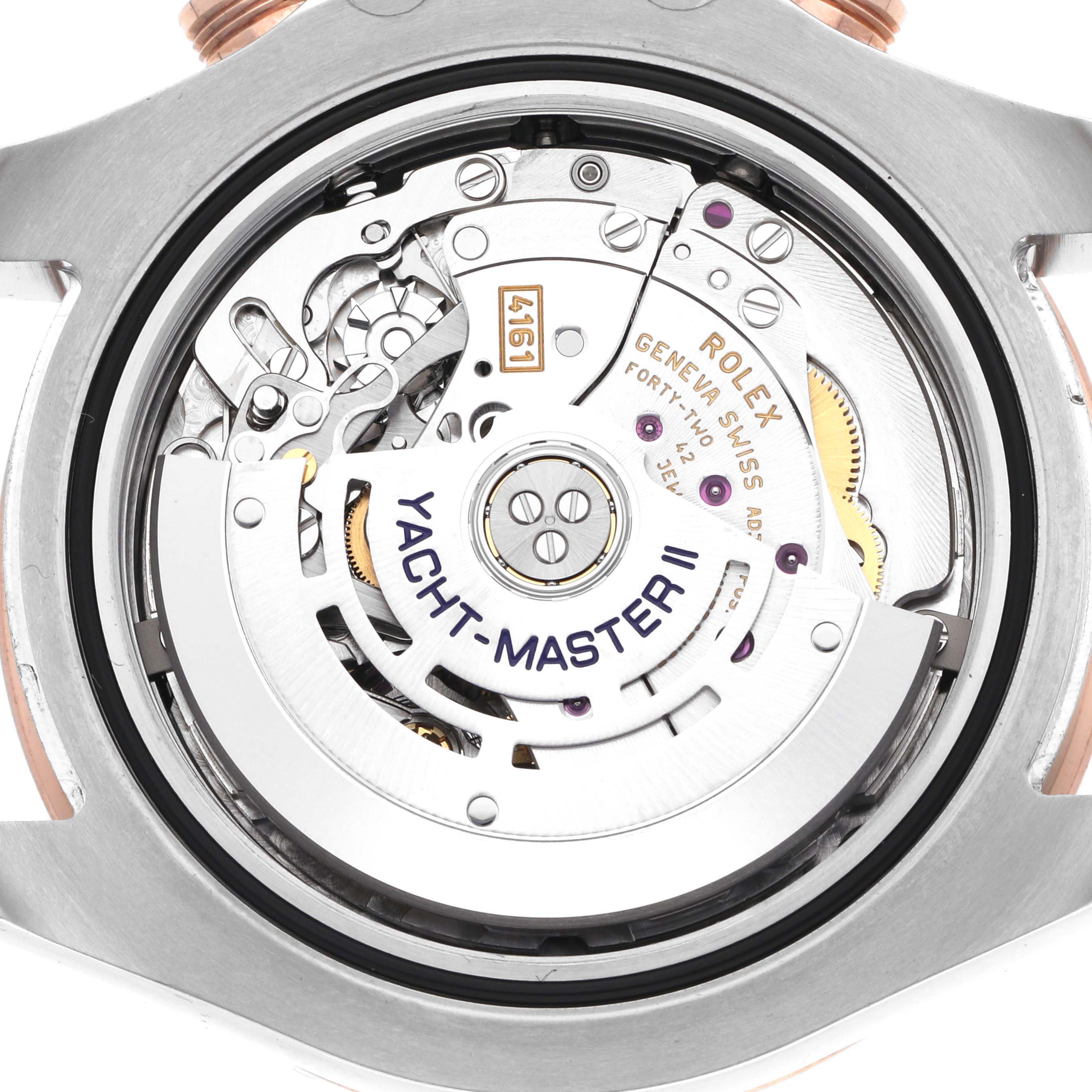 The image shows the back view of the Rolex Yacht-Master 116681 Men
s Steel and Gold (two tone) White Dial 116681 Men
s Steel and Gold (two tone) White Dial watch, highlighting its intricate movement and internal components.