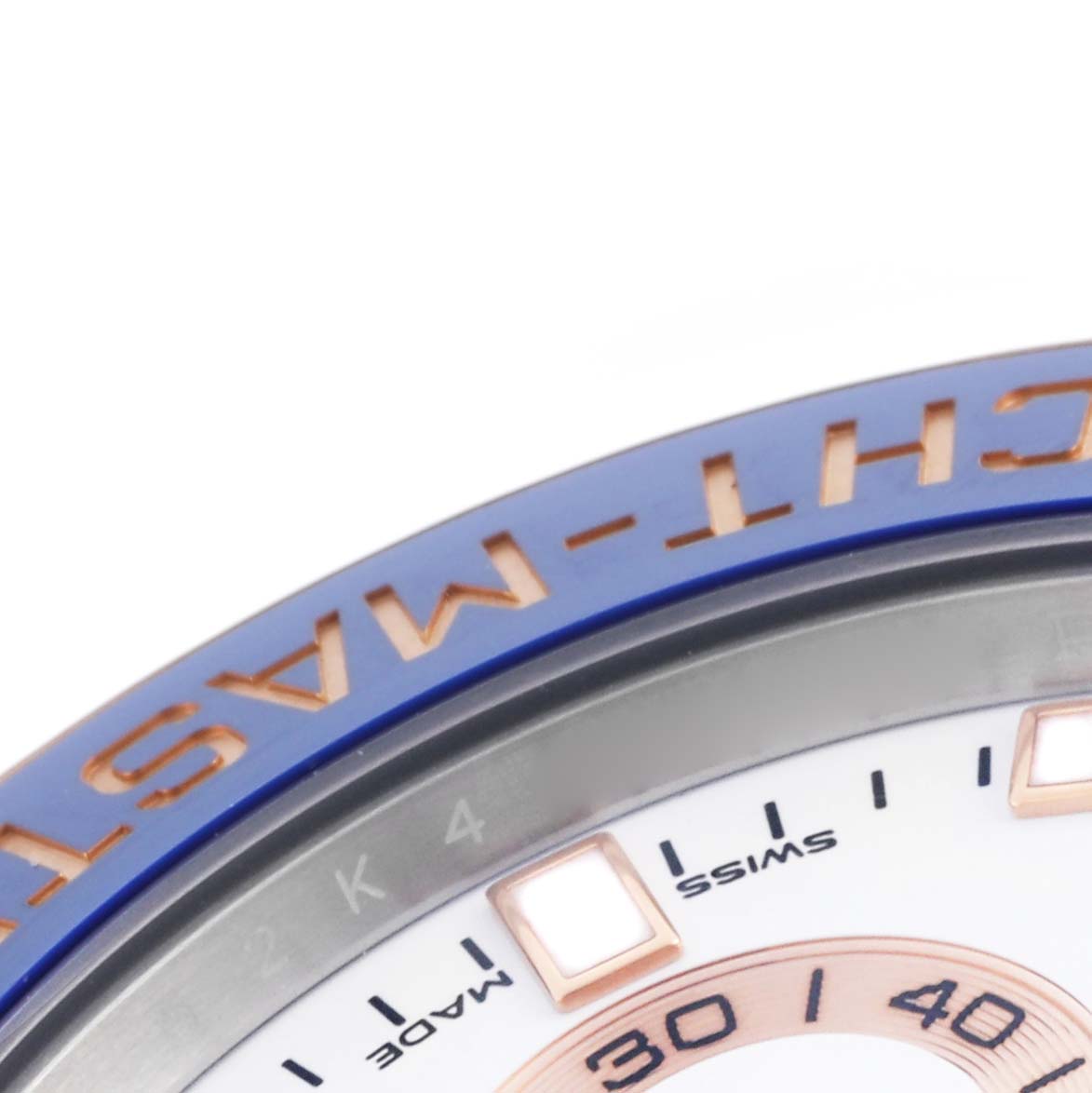 The image shows the edge of the Rolex Yacht-Master 116681 Men's Steel and Gold (two tone) White Dial 116681 Men's Steel and Gold (two tone) White Dial watch, highlighting the bezel and part of the dial.