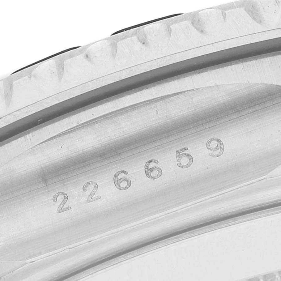 The image shows a close-up of part of the bezel and inner rim with engraved numbers from the Rolex Yacht-Master 226659 Men's White Gold Black Dial.