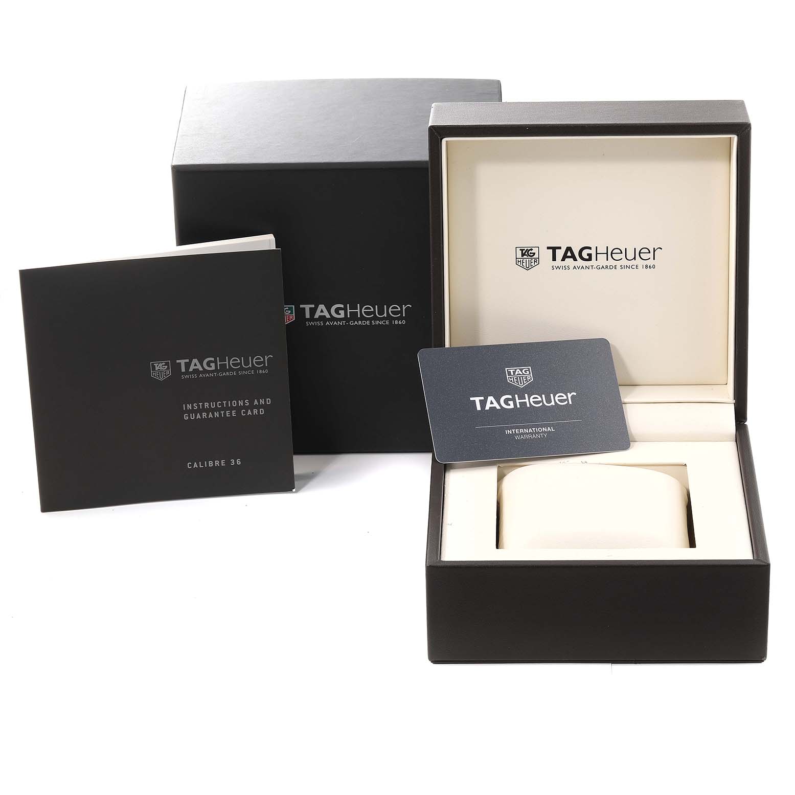 The image shows the box, instruction manual, and warranty card for the Tag Heuer Carrera CAR2B80.FC6325 Men's Titanium Black Dial CAR2B80.FC6325 Men's Titanium Black Dial watch.