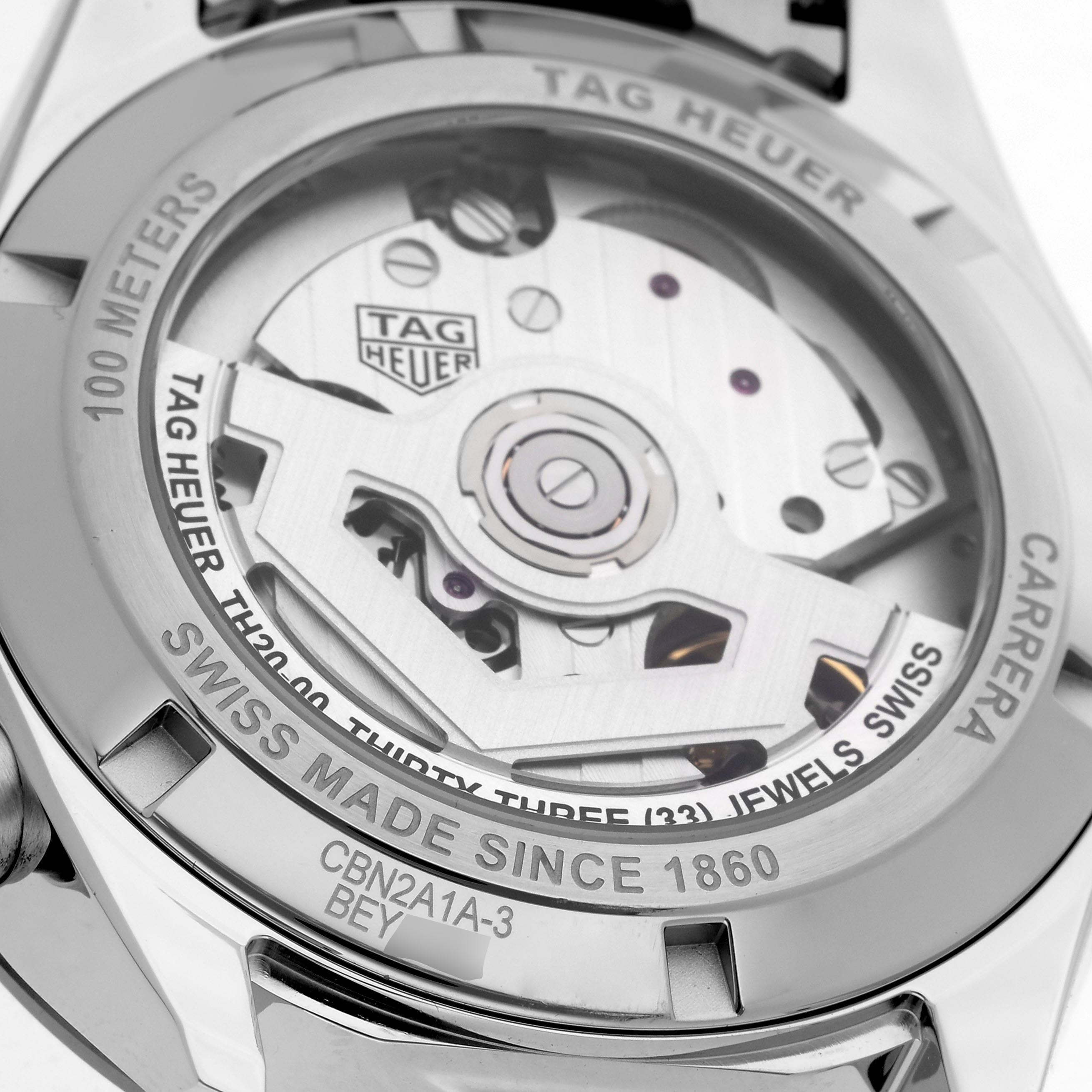 The image shows the back of the Tag Heuer Carrera CBN2A1A.BA0643 Men's Stainless Steel Blue Dial CBN2A1A.BA0643 Men's Stainless Steel Blue Dial watch, highlighting the movement and engravings.