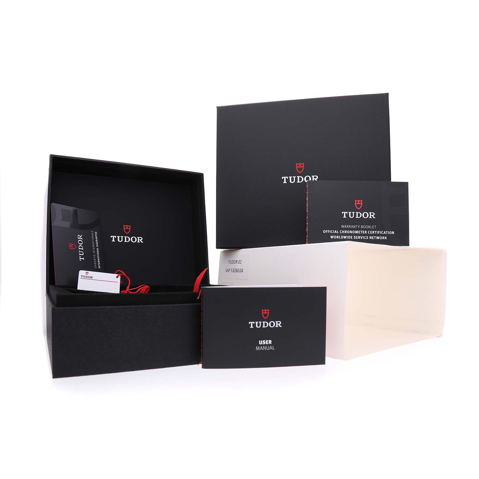 The image shows a Tudor Heritage Black Bay M79000N-0002 Men's Stainless Steel Black Dial packaging, including a box, user manual, and warranty booklet with inserts.
