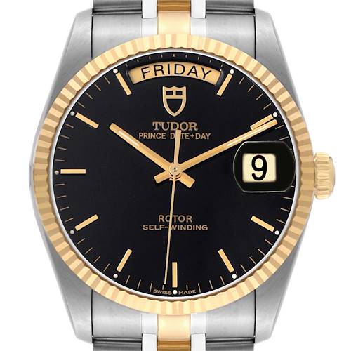The Tudor Prince M76213 Men's Steel and Gold (two tone) Black Dial watch is shown from a front angle, highlighting the black dial, gold accents, day-date display, and fluted bezel.