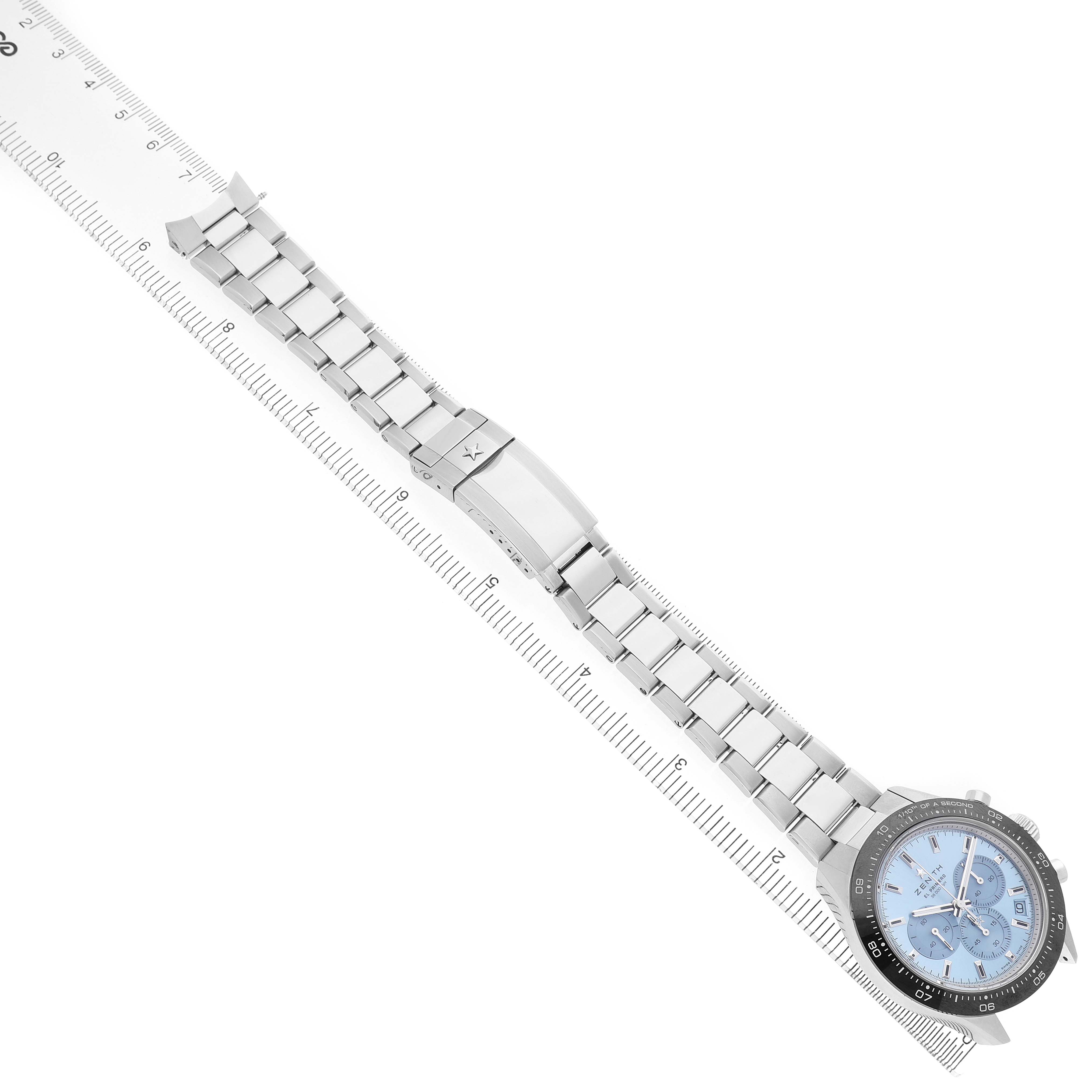 The Zenith Chronomaster 03.3105.3600/52.M3100 Men's Stainless Steel Blue Dial watch is displayed flat, showing the bracelet, clasp, and face, with a ruler indicating length.