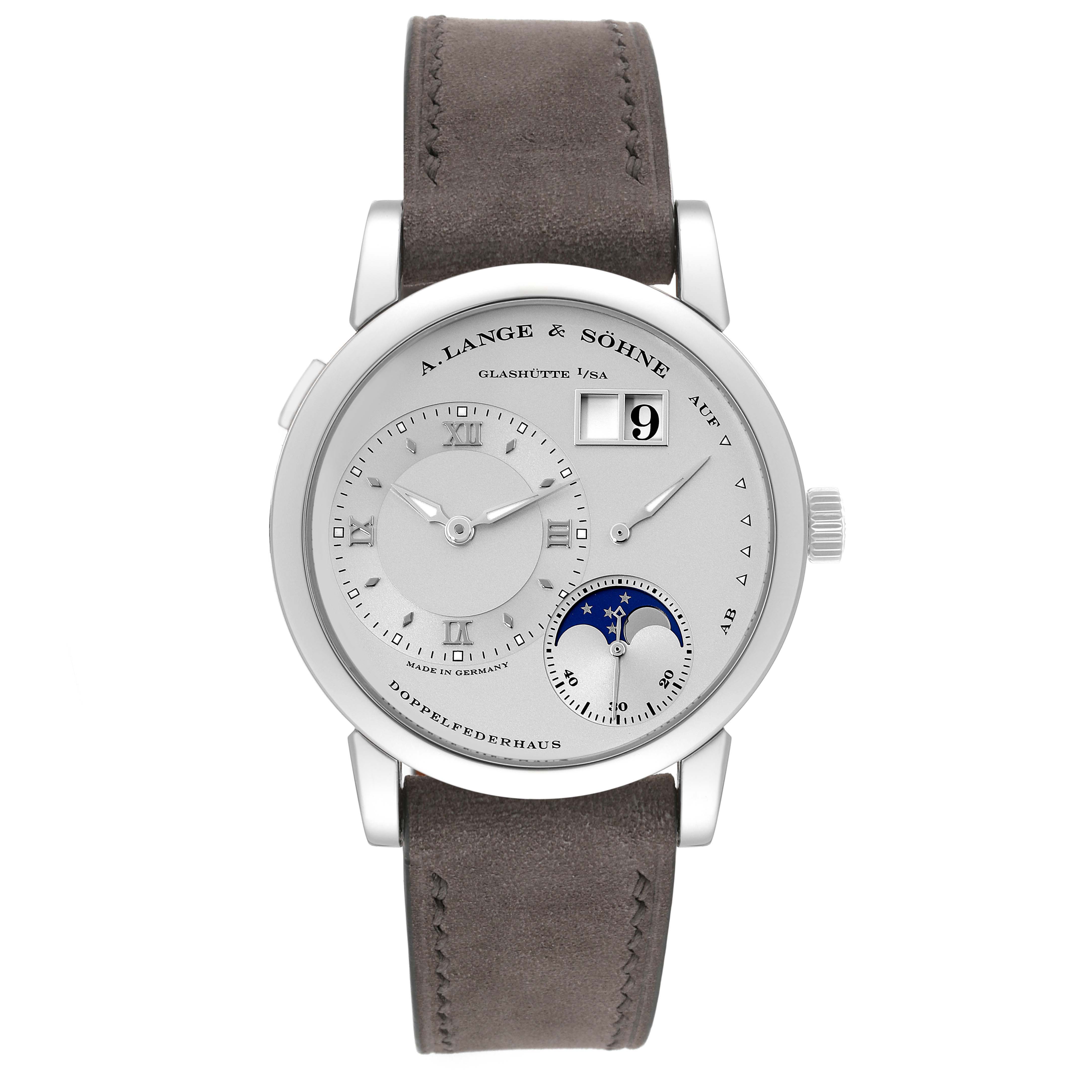 The image shows a front view of the A. Lange & Sohne Lange 1 109.025 Men's Platinum Silver Dial watch, featuring its dial, strap, and crown.