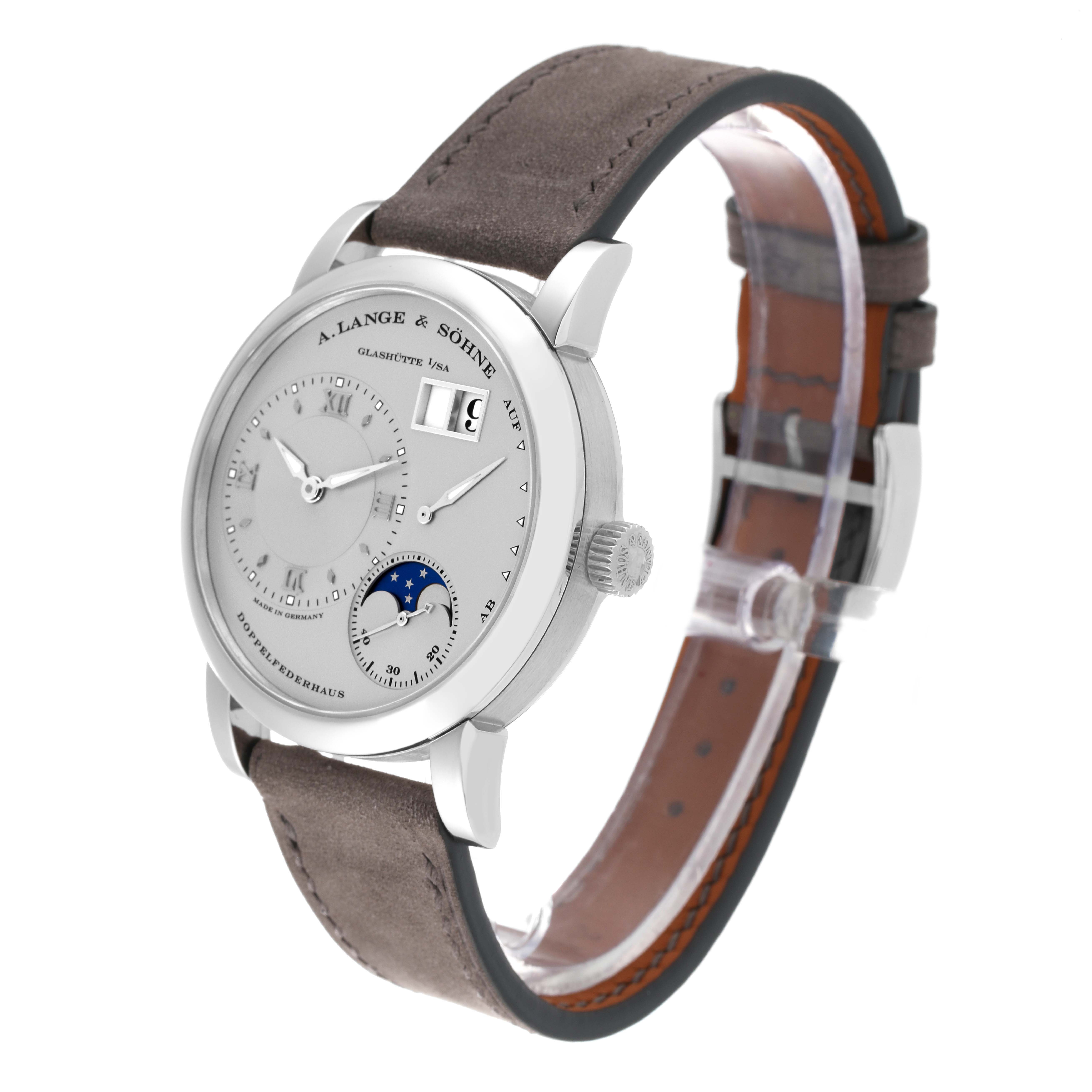 The image shows a side view of the Lange 1 watch by A. Lange & Söhne, highlighting the dial, case, and strap.