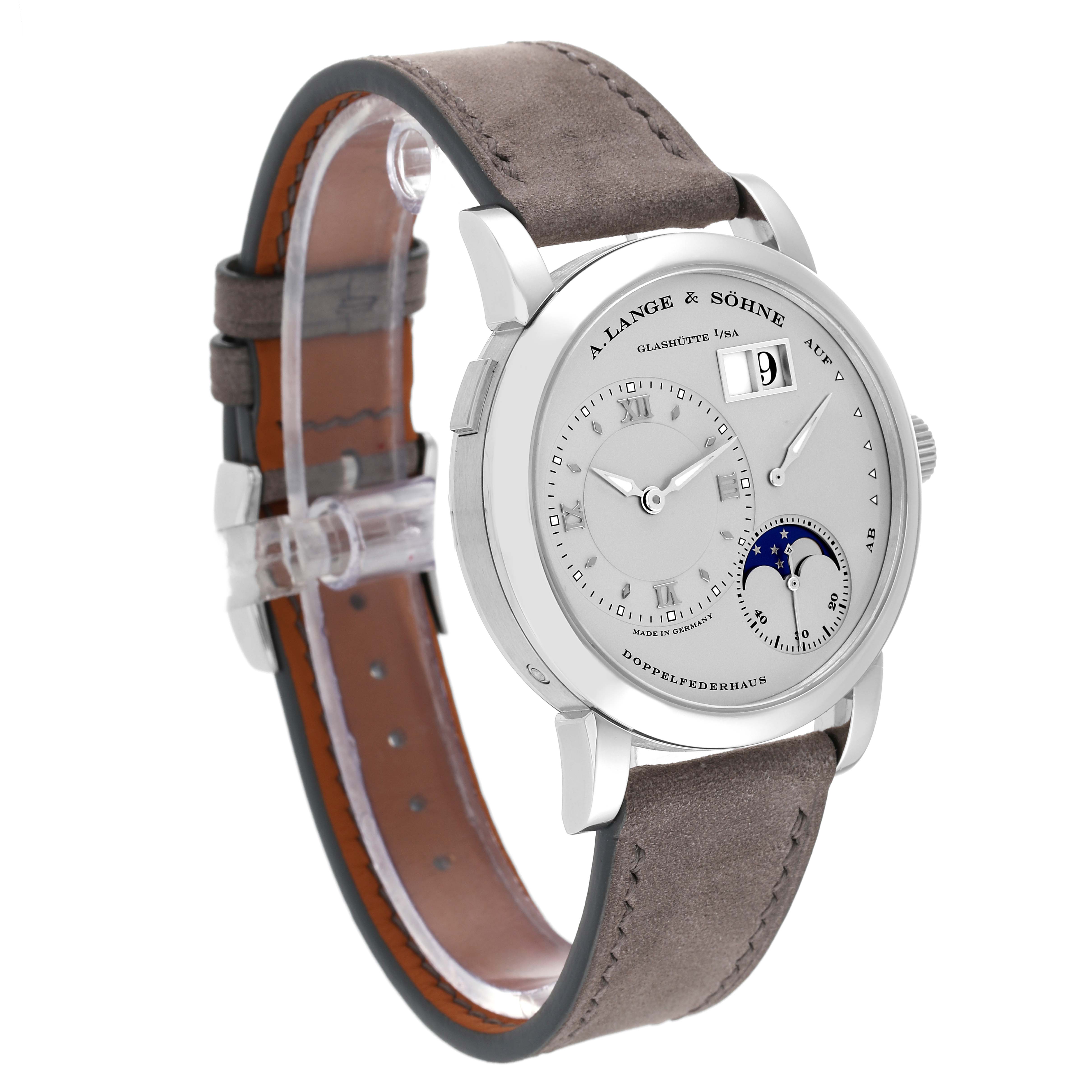 The Lange 1 model by A. Lange & Söhne is shown from an oblique angle, highlighting its dial and grey leather strap.