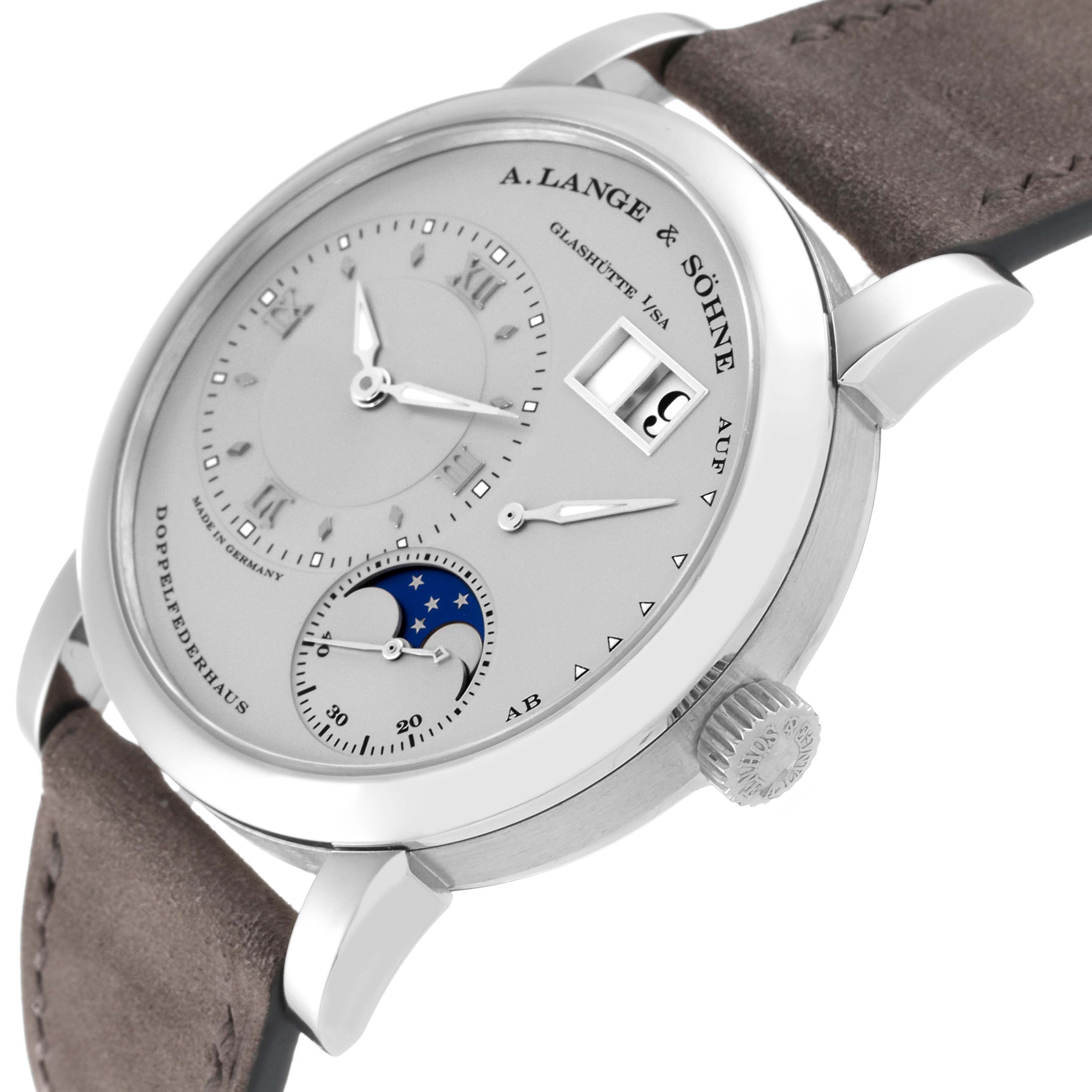 The Lange 1 model by A. Lange & Söhne is shown from a right-side angle, highlighting the dial, subdials, date display, and crown.