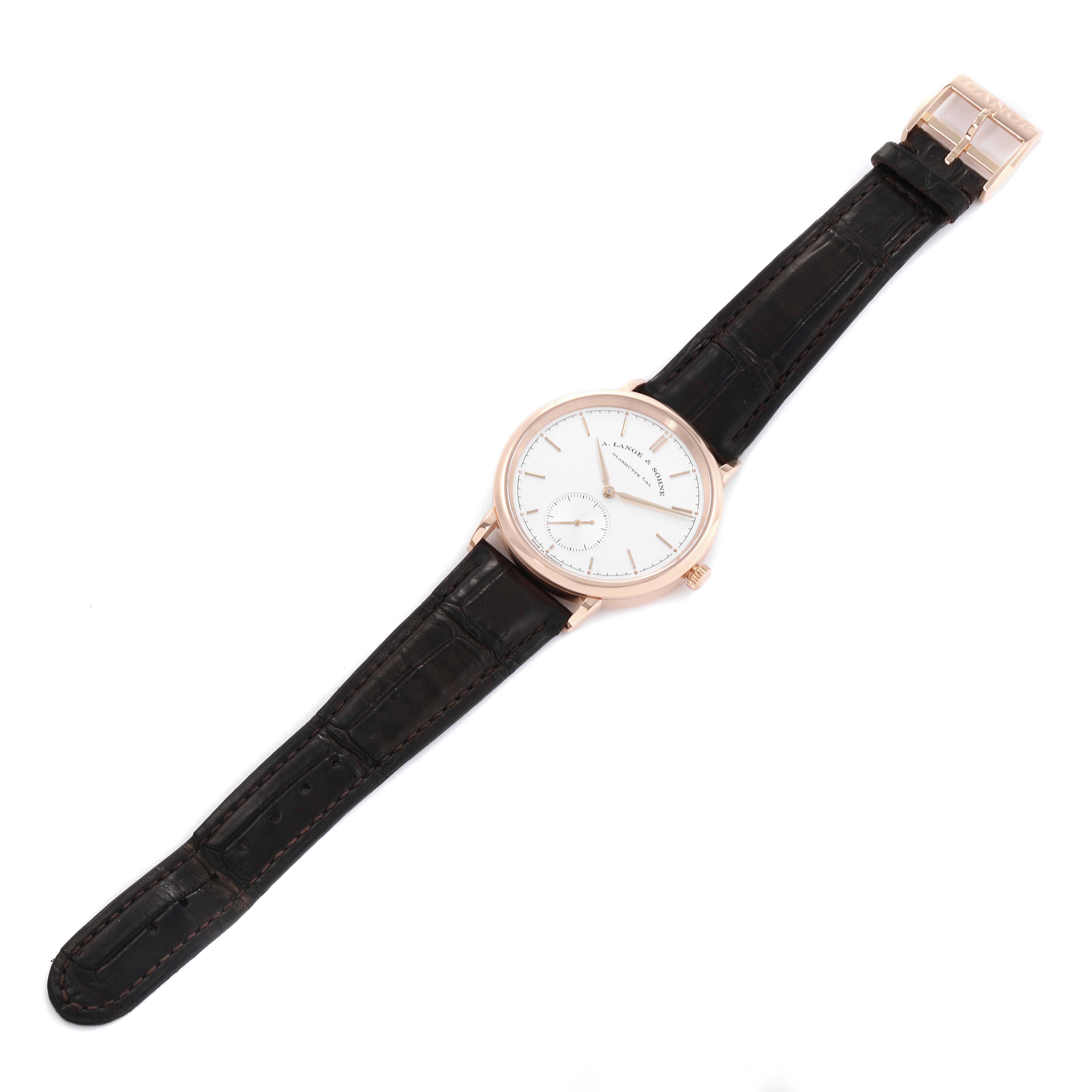 The image shows a full view of the A. Lange & Sohne Saxonia 380.032 Men's Rose Gold Silver Dial watch at a slight top angle, including its dial and black leather strap.